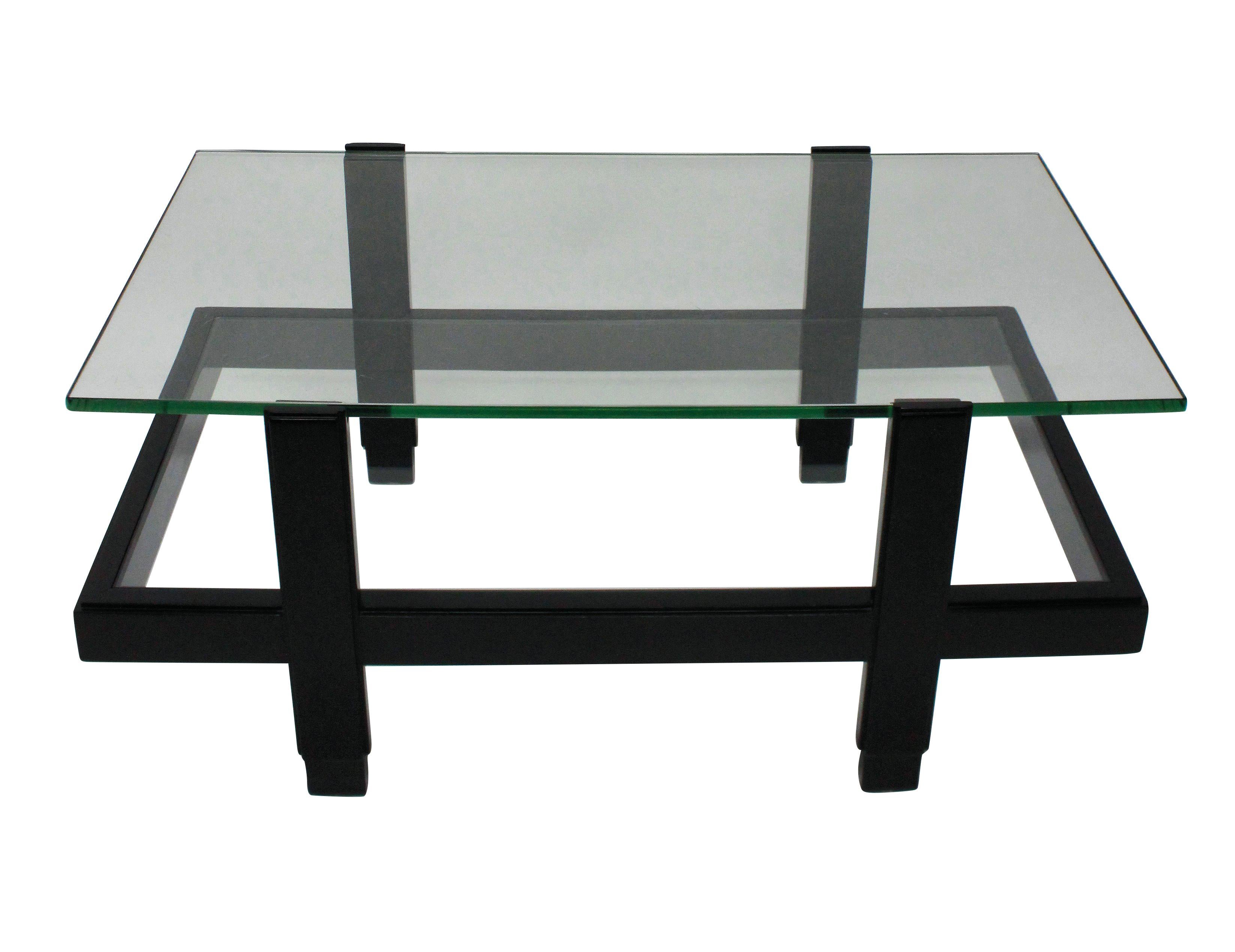 An Italian occasional table comprising two glazed tiers in black lacquered hardwood.