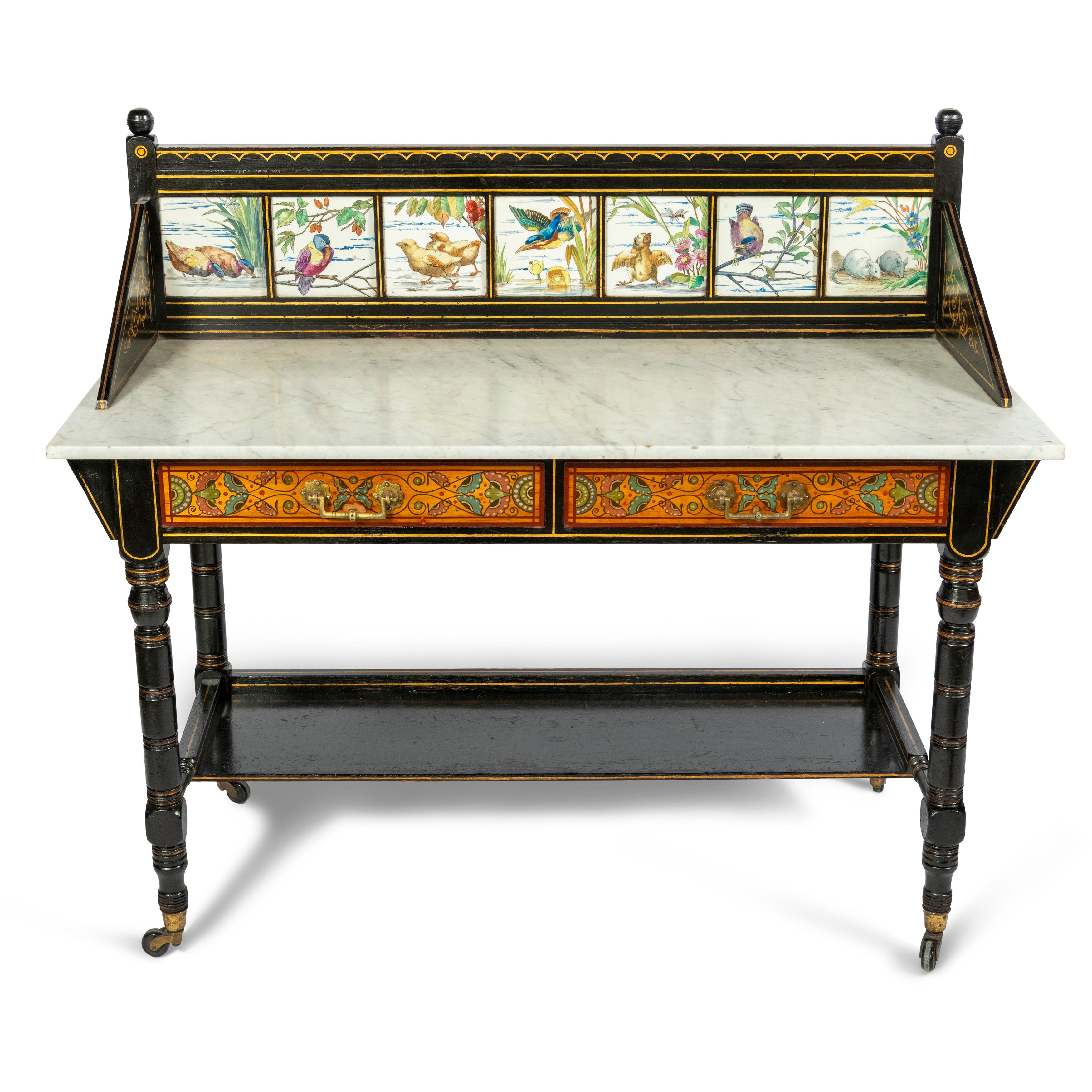 Ebonized Wash Stand by Heals of London, Circa 1890

The frame with gilt stylized detailing and the back stand with 7 hand painted porcelain tiles depicting birds and foilage

White marble table top and the frieze with 2 beautifully painted drawers