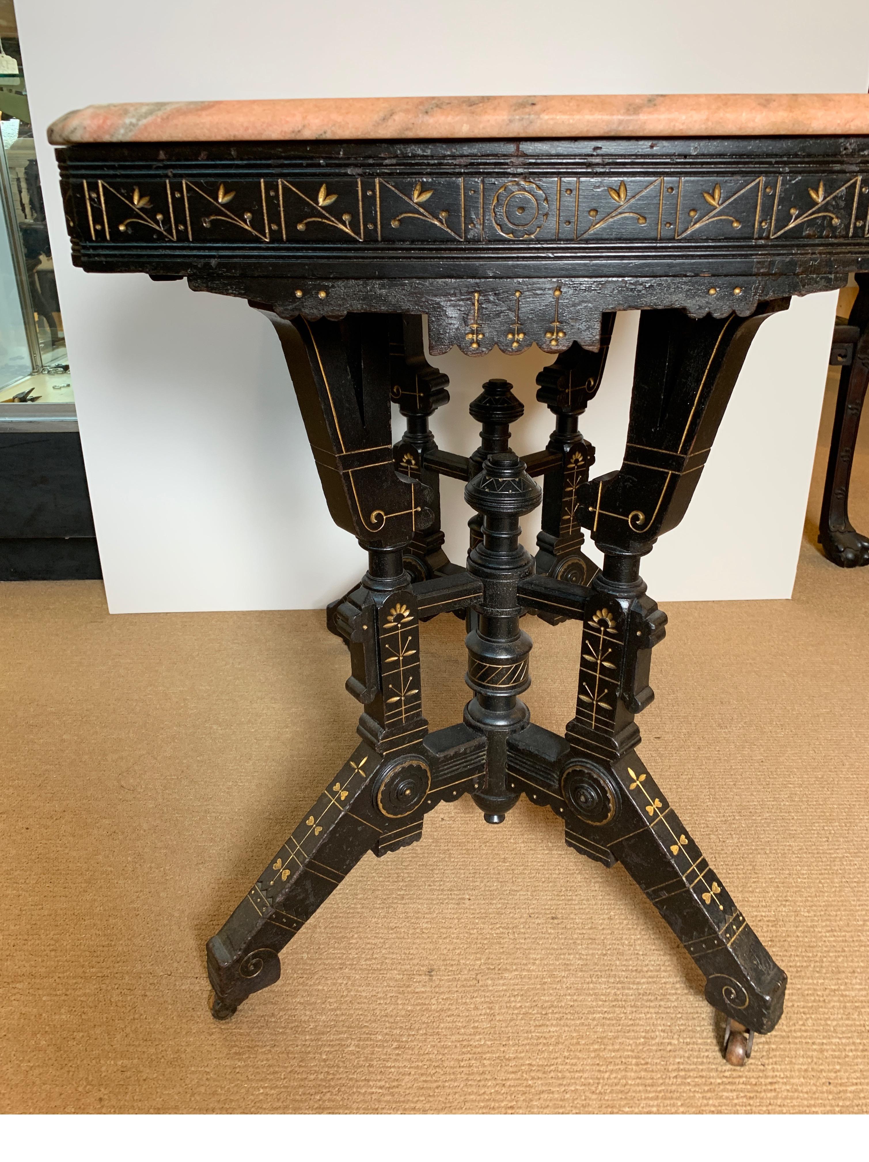 Wood Ebonized Aesthetic Movement Parlor Table with Pink Marble Top and Gold Decor