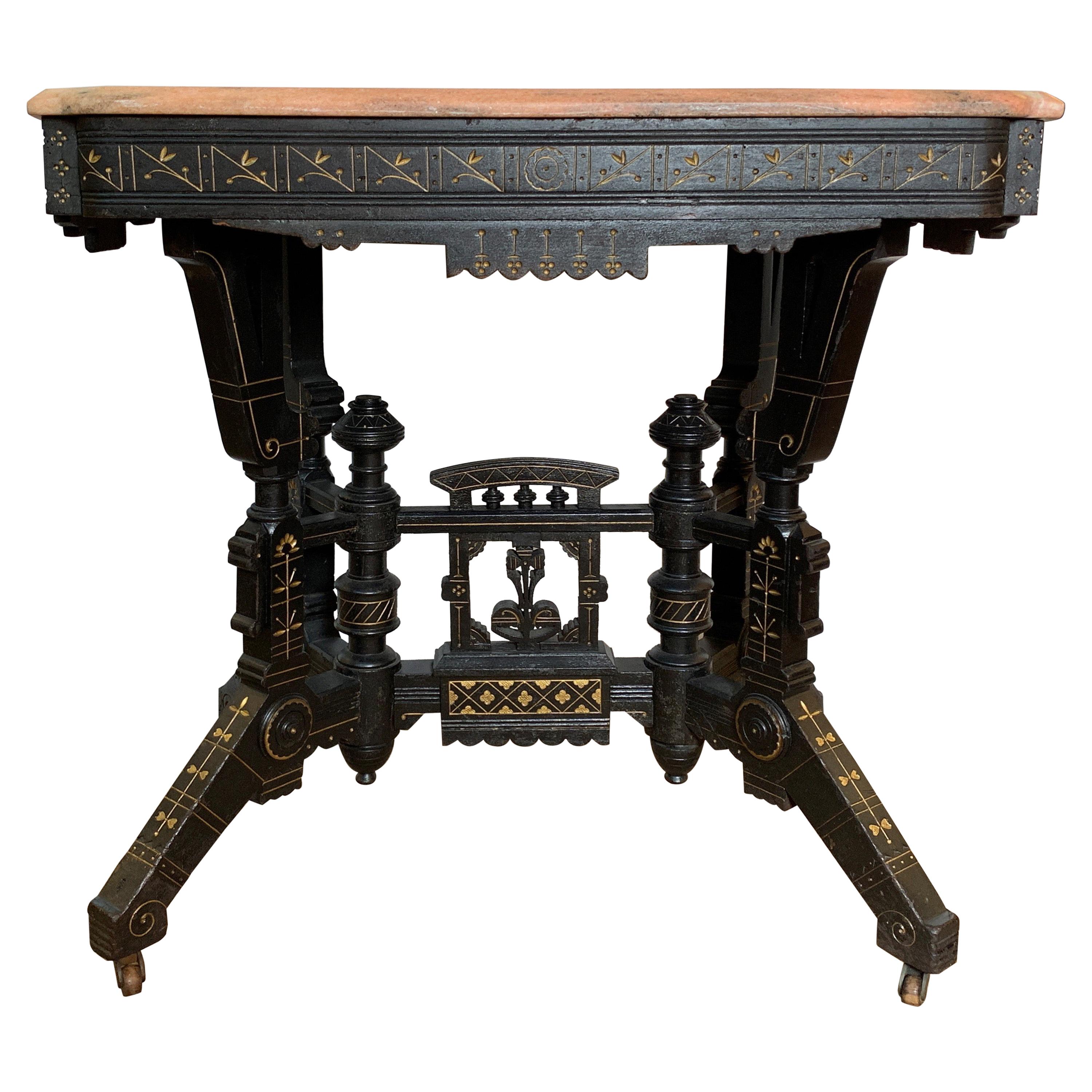 Ebonized Aesthetic Movement Parlor Table with Pink Marble Top and Gold Decor