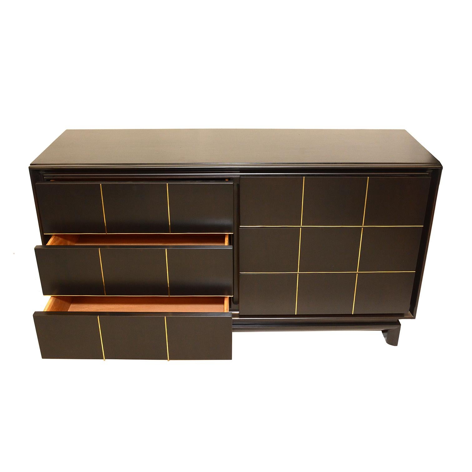 Merton Gershun for American of Martinsville. Gershun was a prolific designer of mid-century furniture credited with bringing darker woods into his classic designs. An impressive six-drawer ebonized mahogany low boy dresser. The piece is accented by