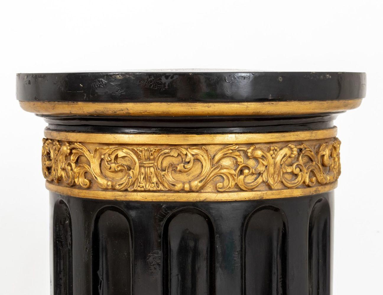 Ebonized and Gilded Carved Wood Column Pedestal, circa 1960, with fluted sides, round top and base. 32