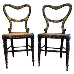 Ebonized and Gold Leaf Painted Regency Chairs, a Pair