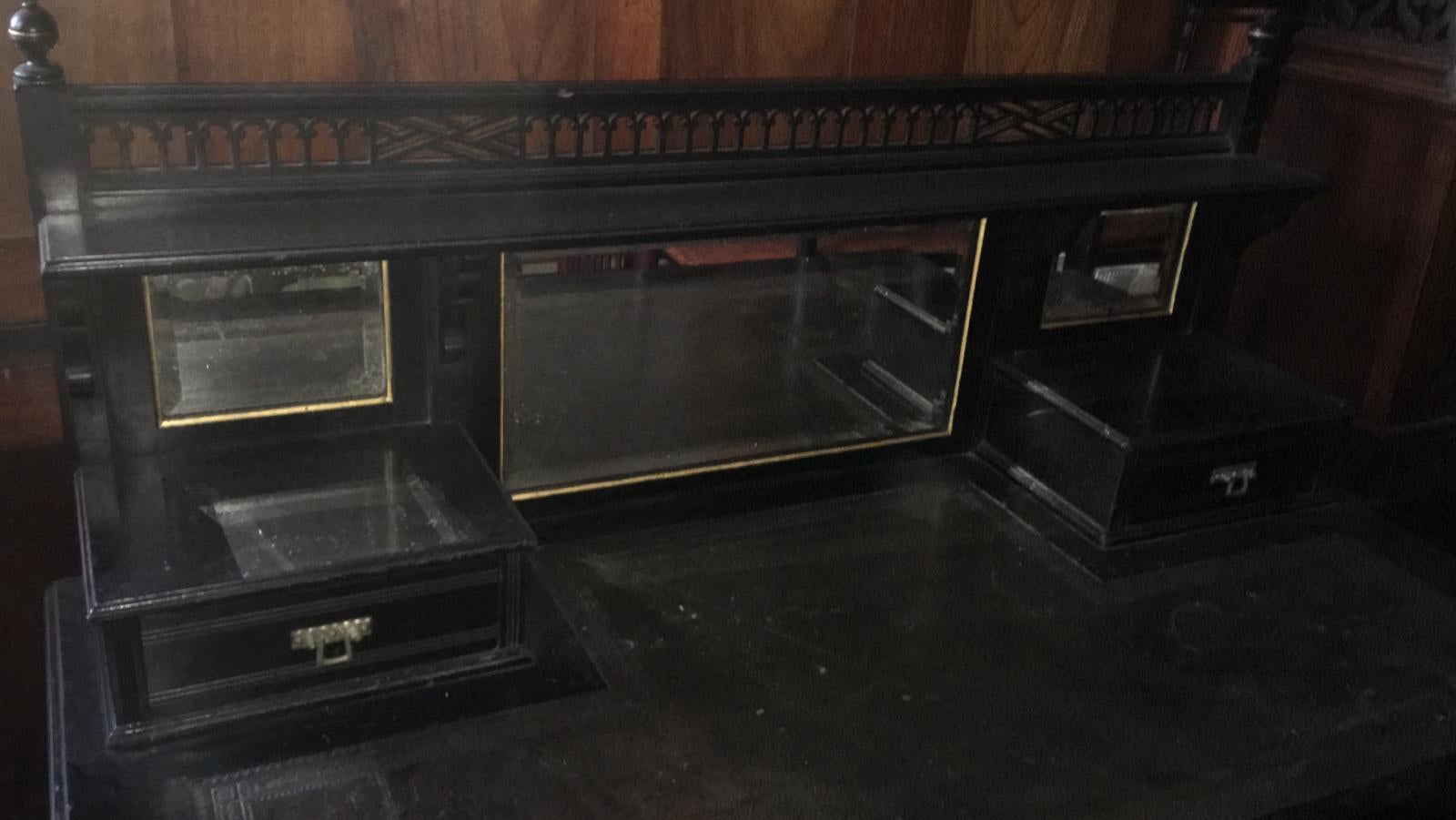 An ebonized and gilt Aesthetic Movement desk with leather writing area. 
By Maple and Co, stamped to locks.
 