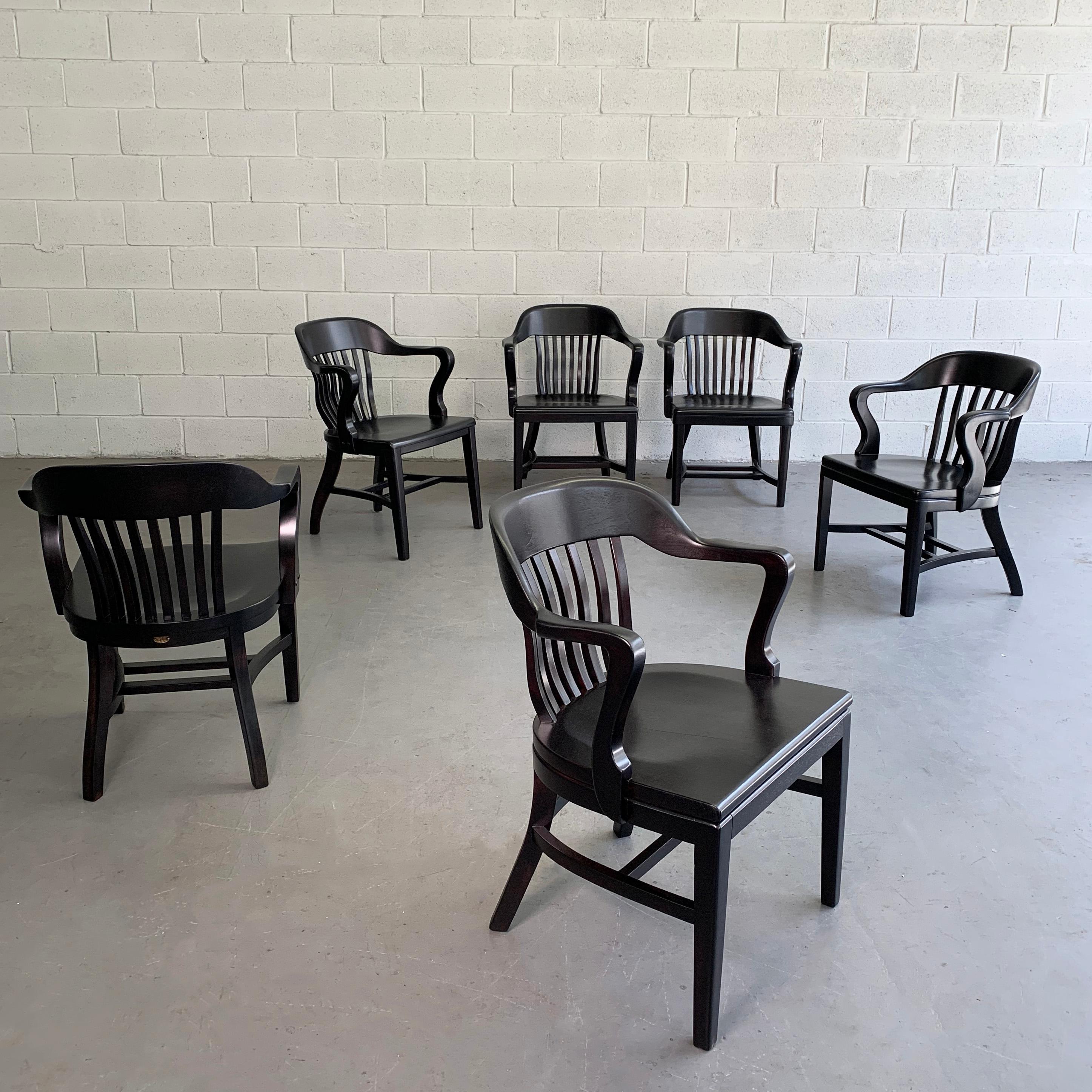 Classic, maple and oak, bank of England, courthouse, armchairs by Gunlocke, Sikes and Library Bureau Makers in an ebonized finish. The chairs differ ever so slightly due to the makers. Six available now, sold individually.