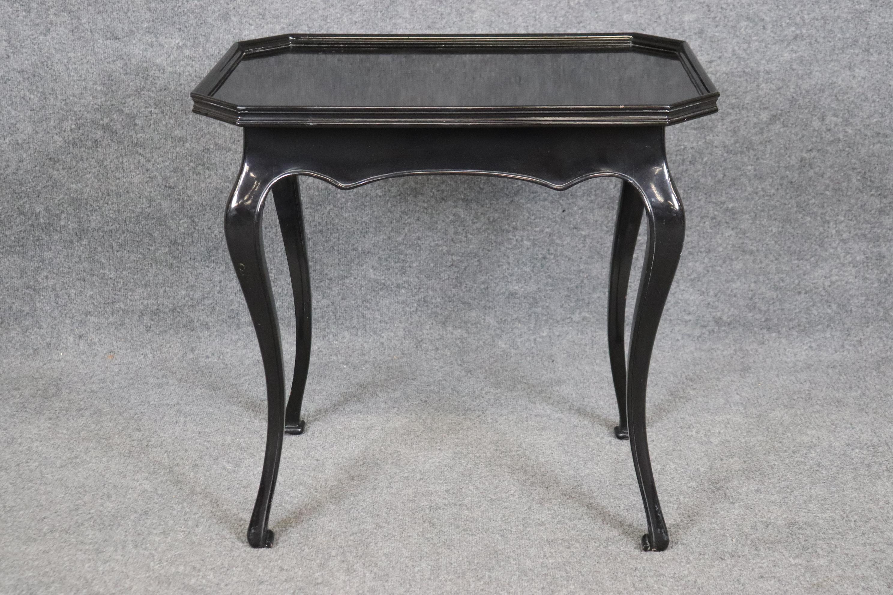 This is a gorgeous and unique and beautiful ebonized Georgian style end table. The table is in good condition and will show minor signs of age and use such as scuffs and fine scratches on top. Nothing serious. Measures 25.25 tall x 25.75 wide x 18