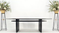 Tavolo da pranzo e biblioteca con piano in sughero galleggiante in mogano laccato nero ebanizzato