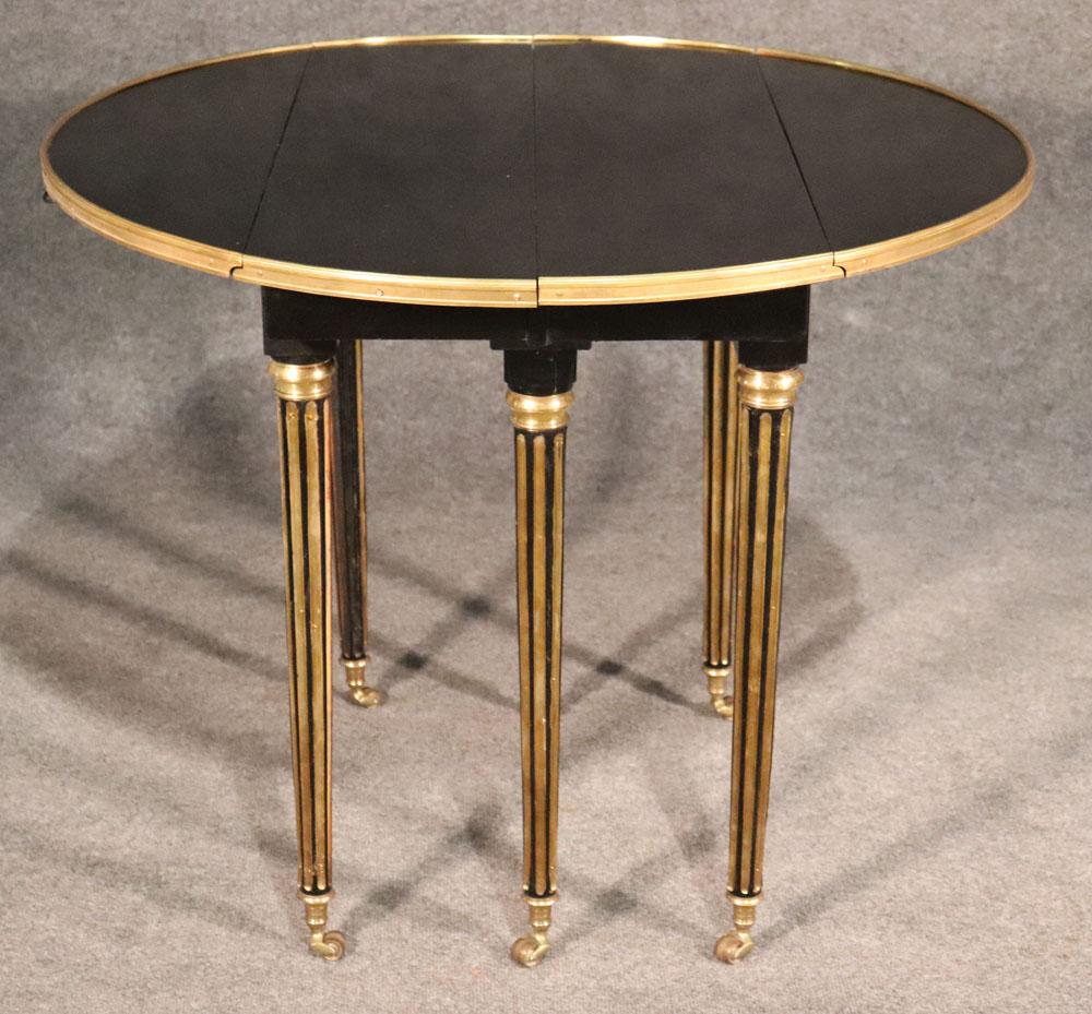 Mid-20th Century Ebonized Black Lacquered Ebonized Brass Trimmed Maison Jansen Dining Table