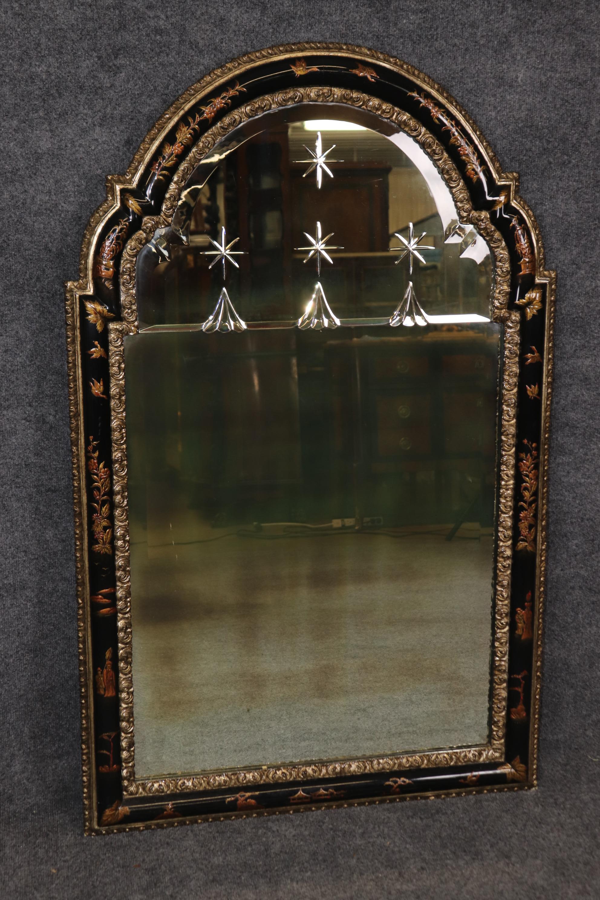 This is a killer, Maison Jansen attributed wall mirror with every bell and whistle a mirror can have. The mirror had precisely etched mirror glass with stars and a gorgeous tombstone shaped frame with Chinoiserie paint decorating depicting cranes