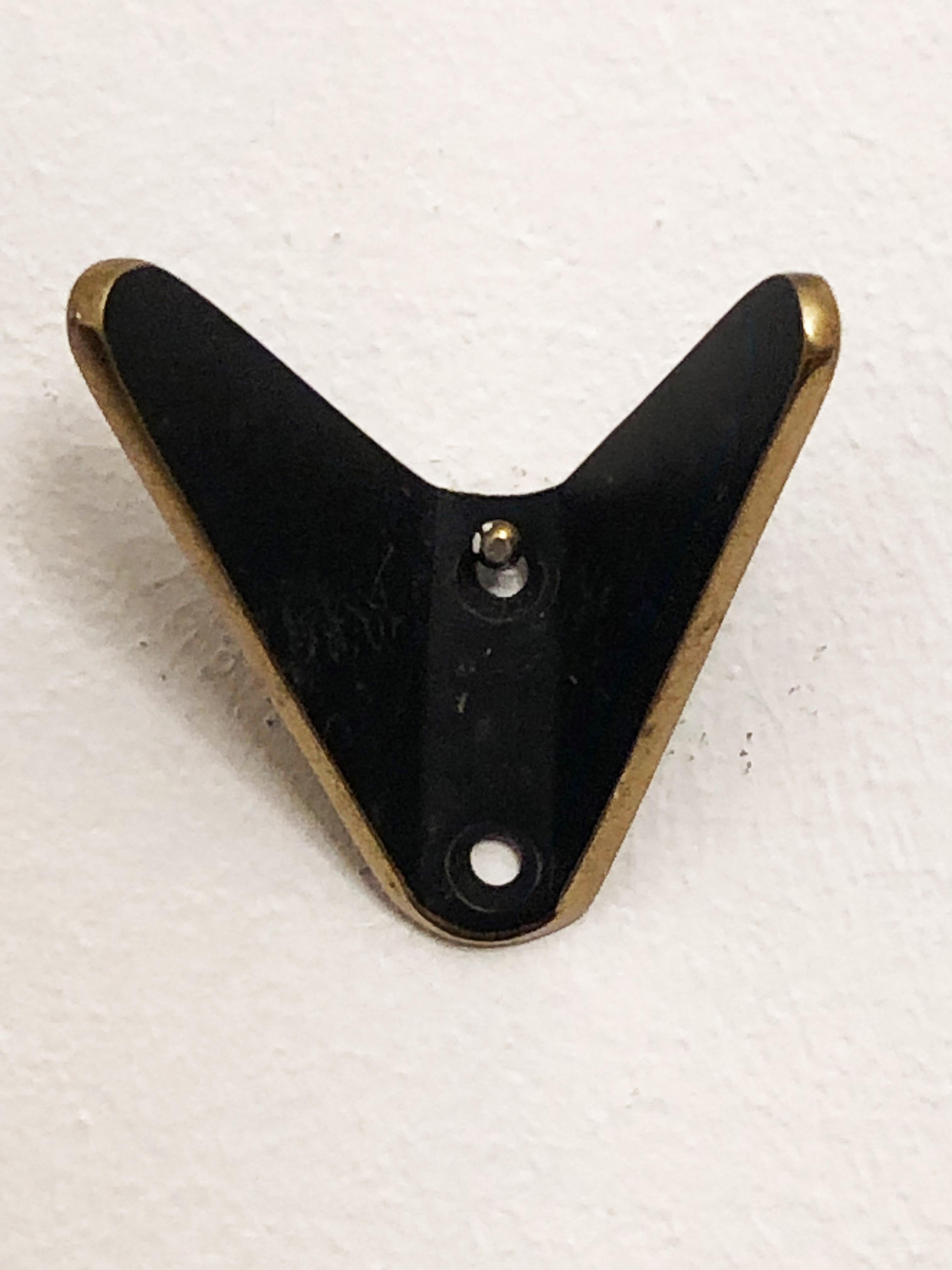 Beautiful Austrian brass hooks manufactured by Hertha Baller in Austria in the 1950s.
Up to 12 available.