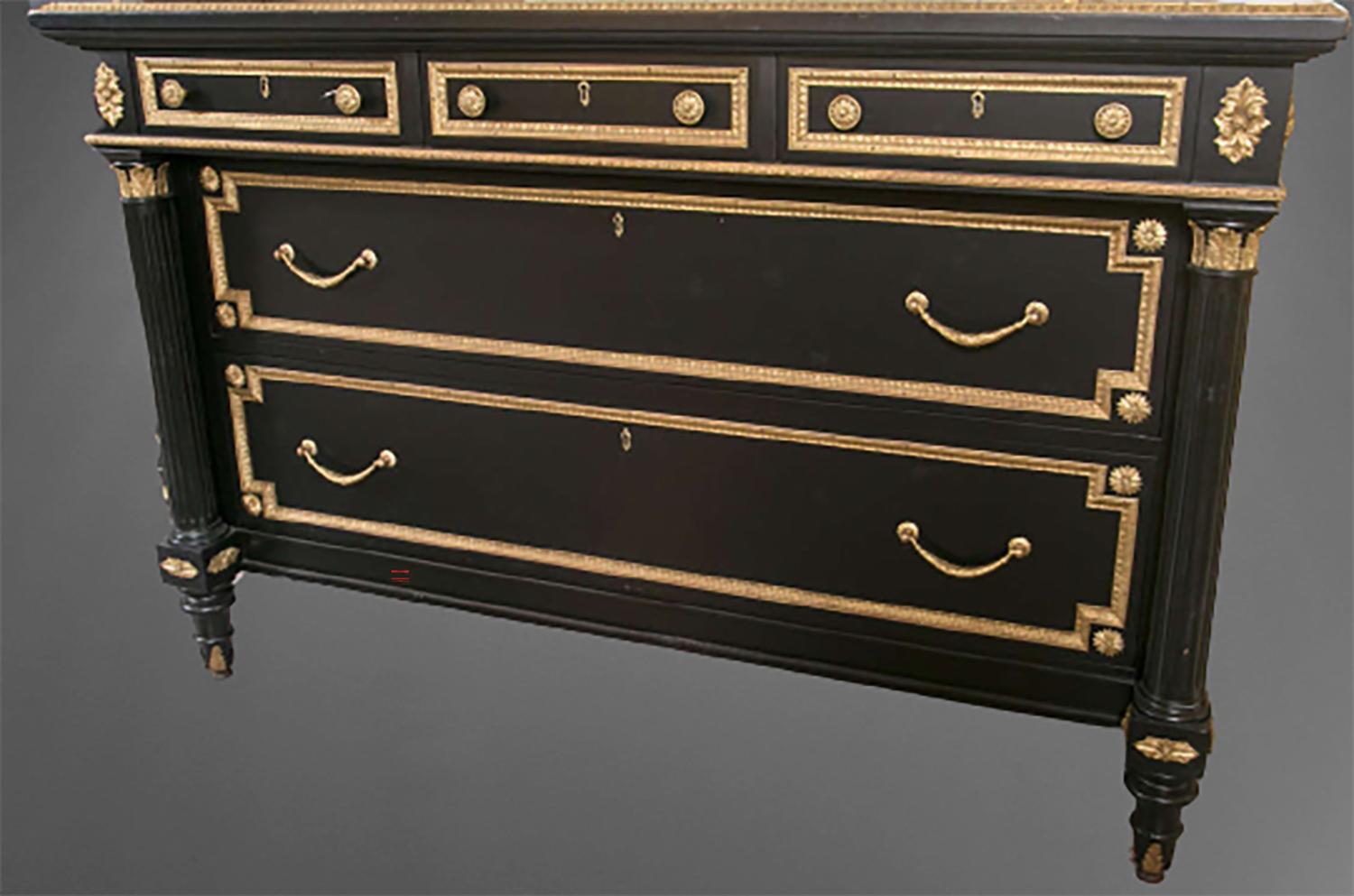 This ebonized bronze-mounted chest portrays the Chateau de Versailles in its finest. The gilt gold adds dimension and beauty to its linear and rectangular elements, the combination of curves and bows complete this magnificently fine piece. Three