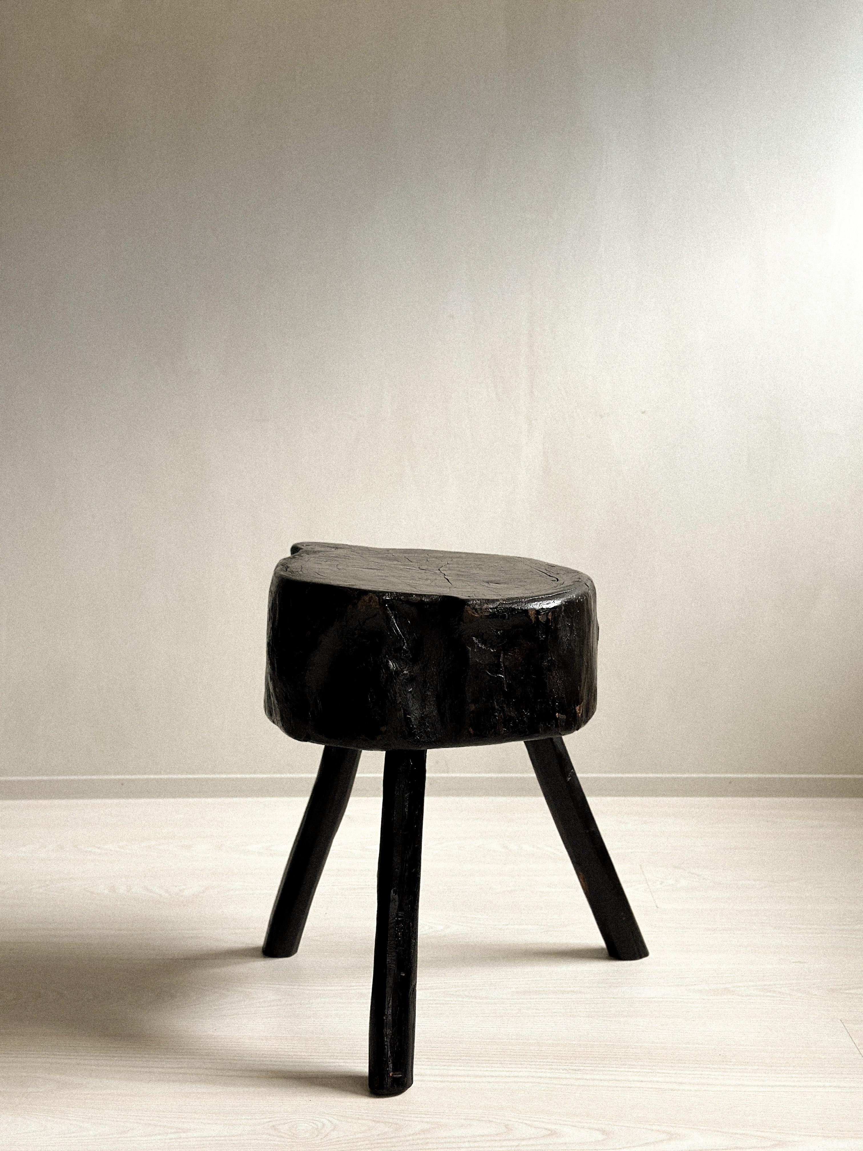 Introducing an exquisite Wabi Sabi Block Stool or Side Table, originally crafted in Spain in the 1960s and later ebonized for added visual impact. This exceptional piece is designed in the unique Wabi Sabi style, showcasing a beautifully distressed