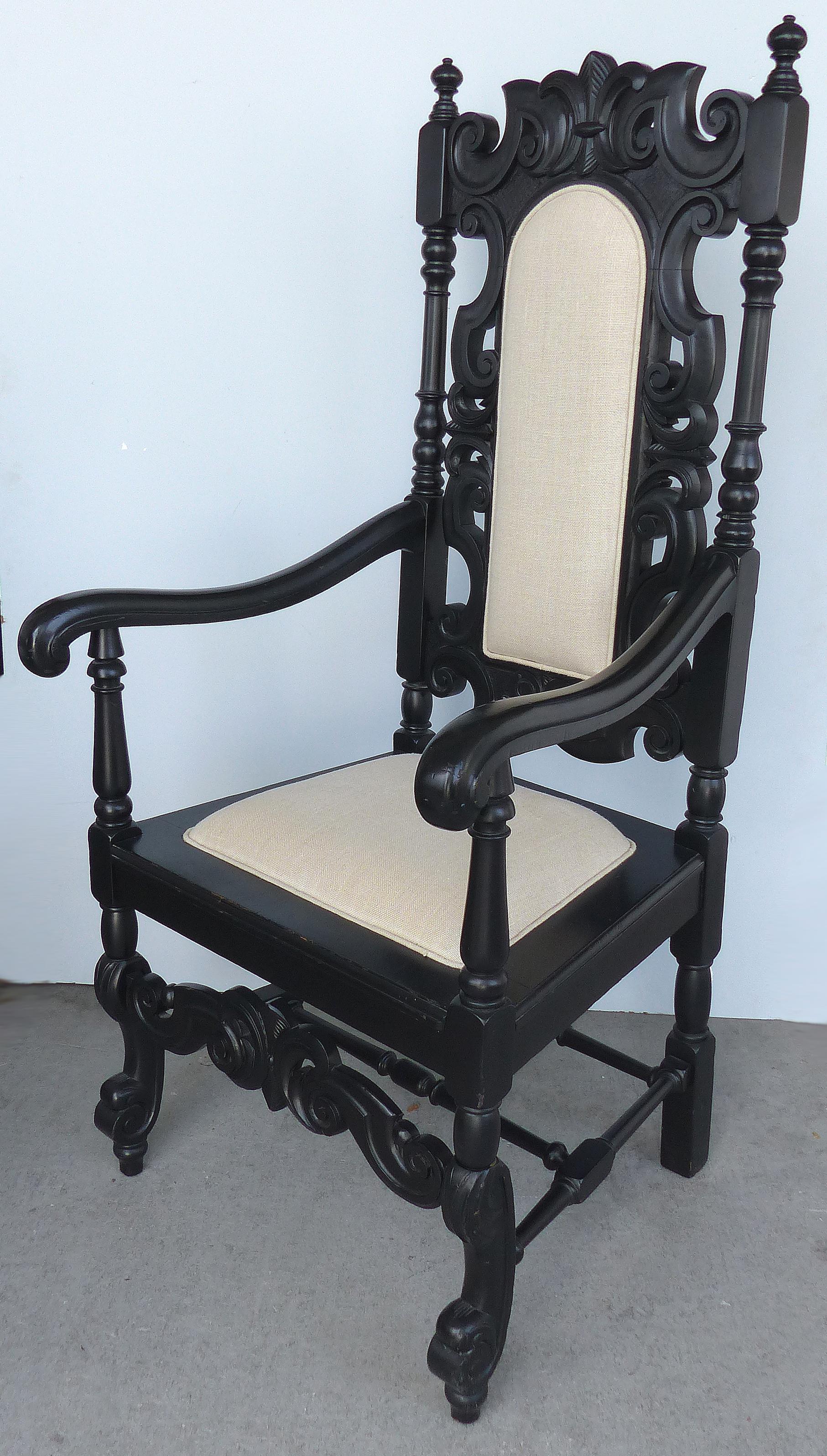Ebonized Carved Wood Armchair with Linen Upholstery

Offered for sale is a large ebonized carved wood armchair with off-white linen upholstery created in the Second quarter of the 20th century. This grand chair is quite sturdy with a turned wood