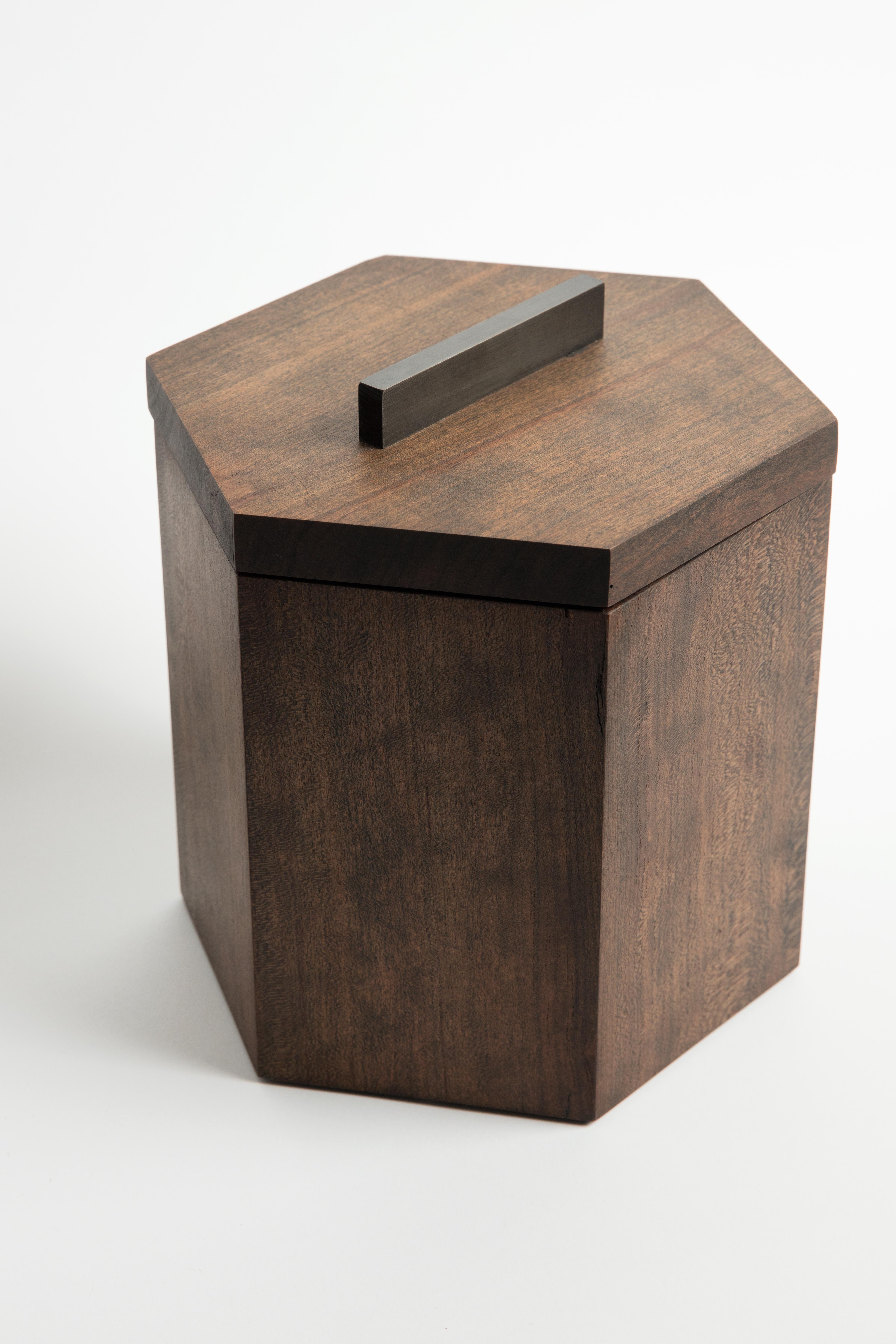 Our ebonized cherrywood ice bucket is handcrafted with solid cherry from Birmingham's urban forest. Modern geometric barware strikes a clean line on your counter. Store ice for cocktails or keep a bottle of your favorite white wine cool and crisp