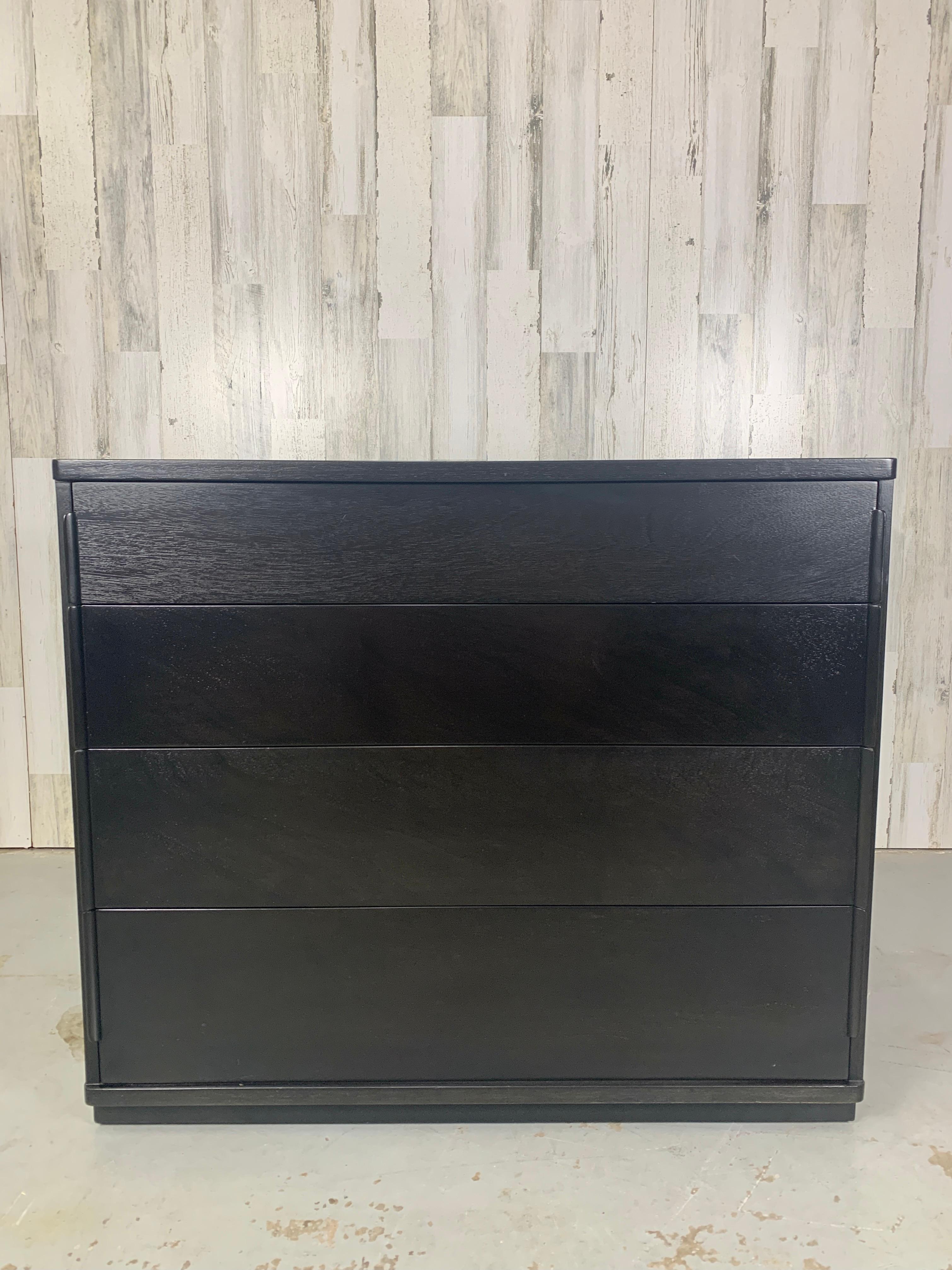 Ebonized chest by Edward Wormley for Dunbar with leather wrapped plinth.