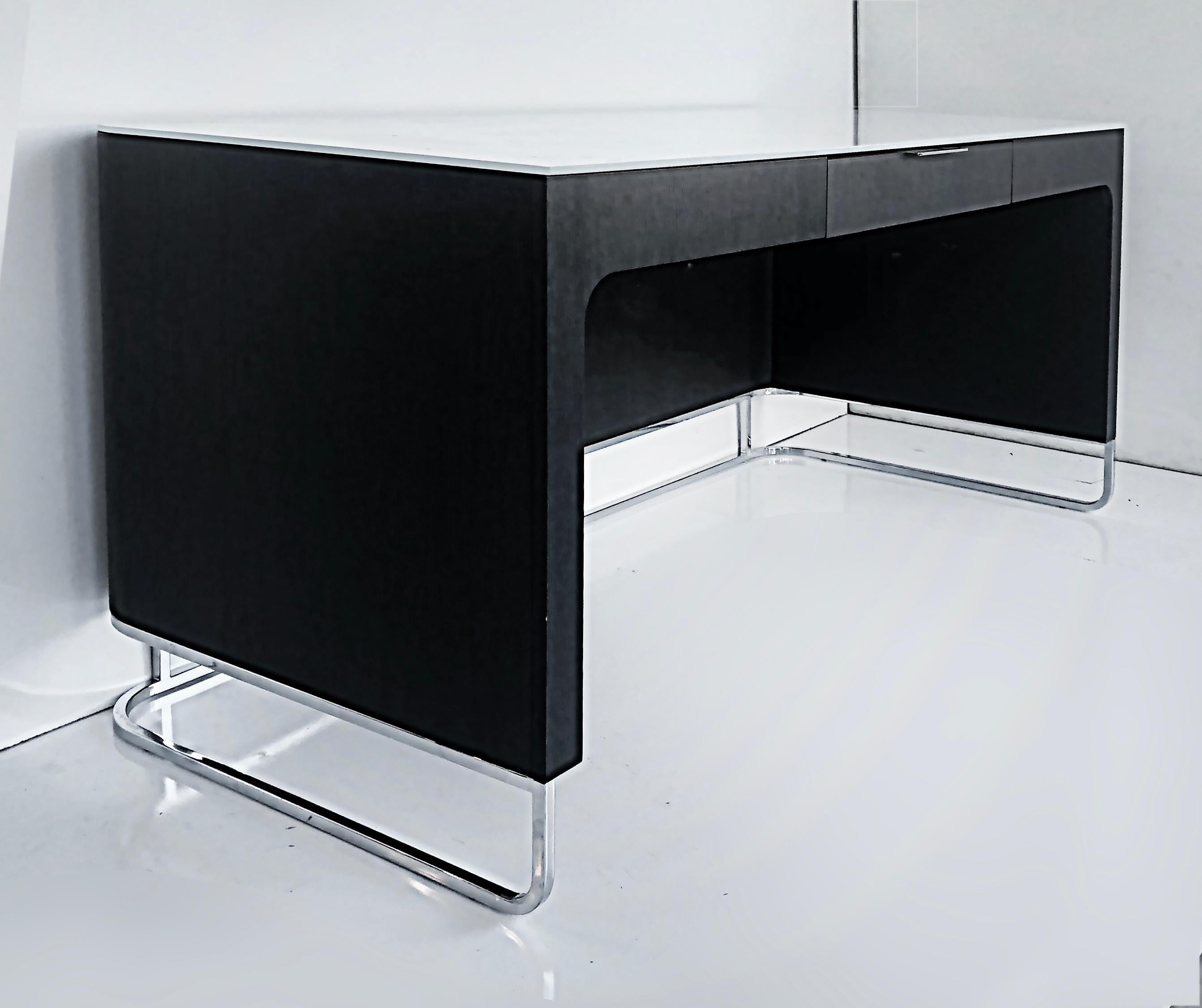 Ebonized Contemporary desk in wood, chrome, glass top, 21st-century.

Offered for sale is a contemporary ebonized wood and chrome desk with a white glass top. The desk has a floating feel and has one metal central drawer. The chrome base frame