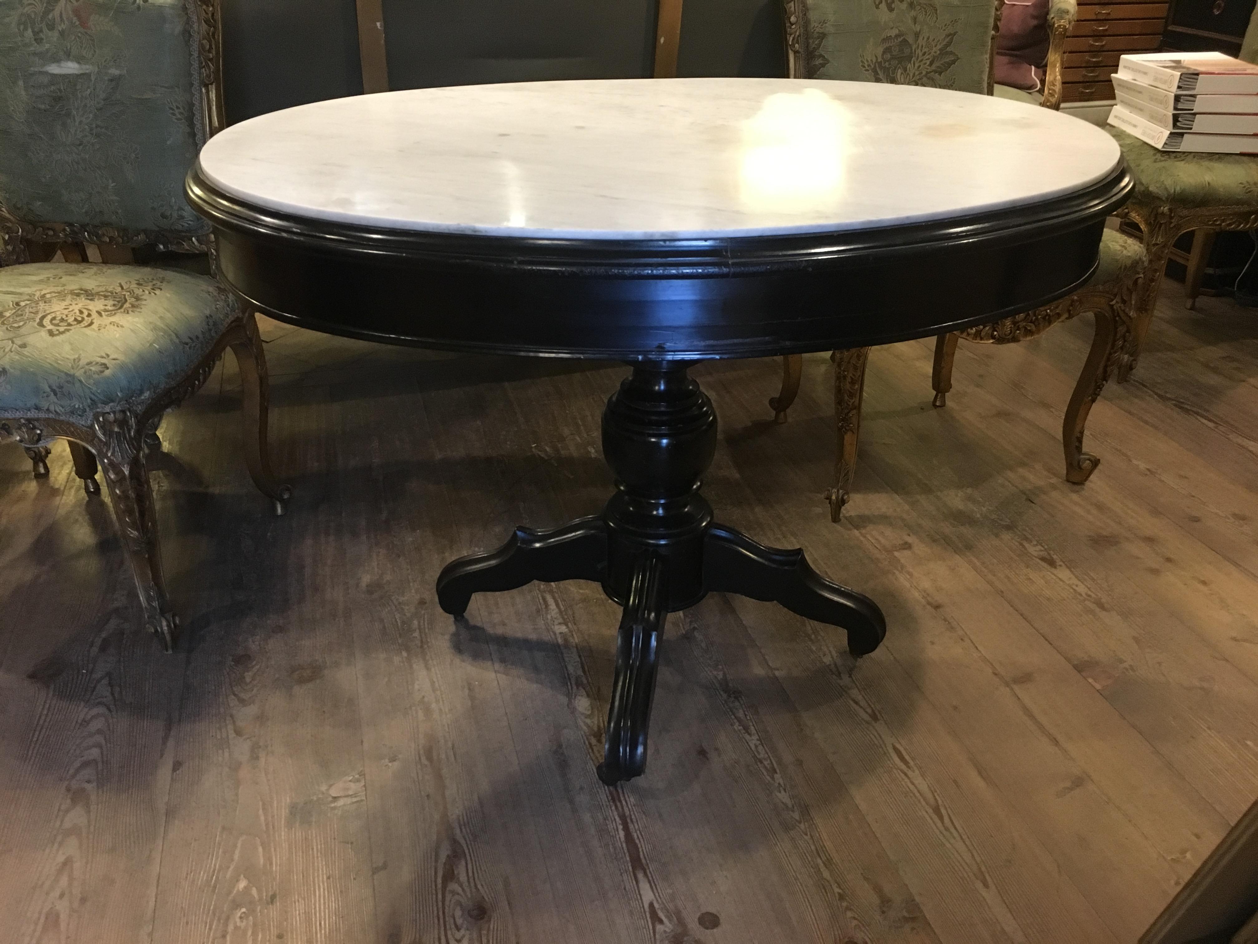 Ebonized English table with Carrara marble top from 1890s.