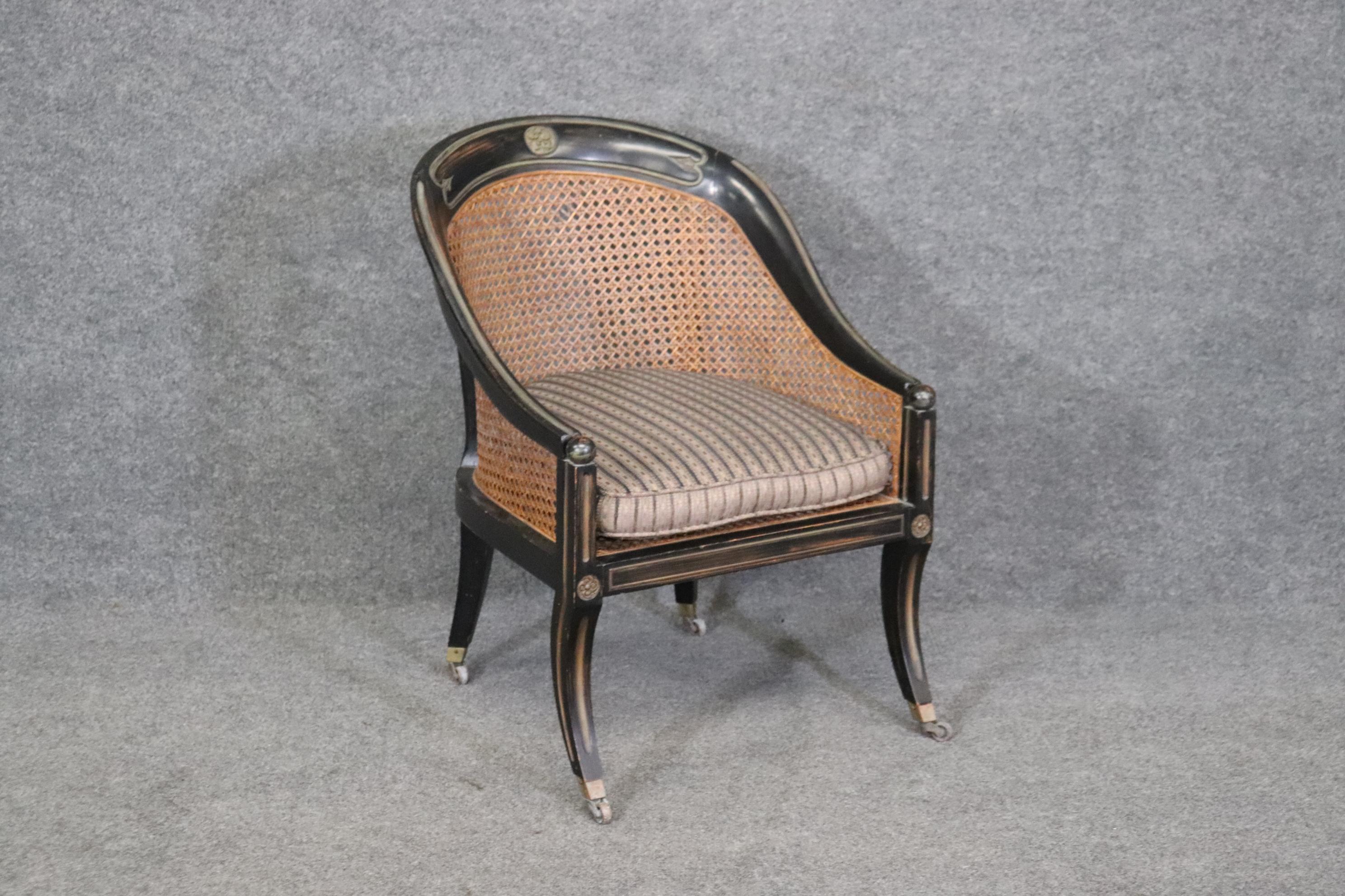 This is a beautiful French Louis XVI cane back lounge chair. The cane has one spot where it is damaged but this can be either loved the way it is or repaired. The chair is from the 1930-40s era and measures 30.75 tall x 22.5 wide x 24.5 deep and the