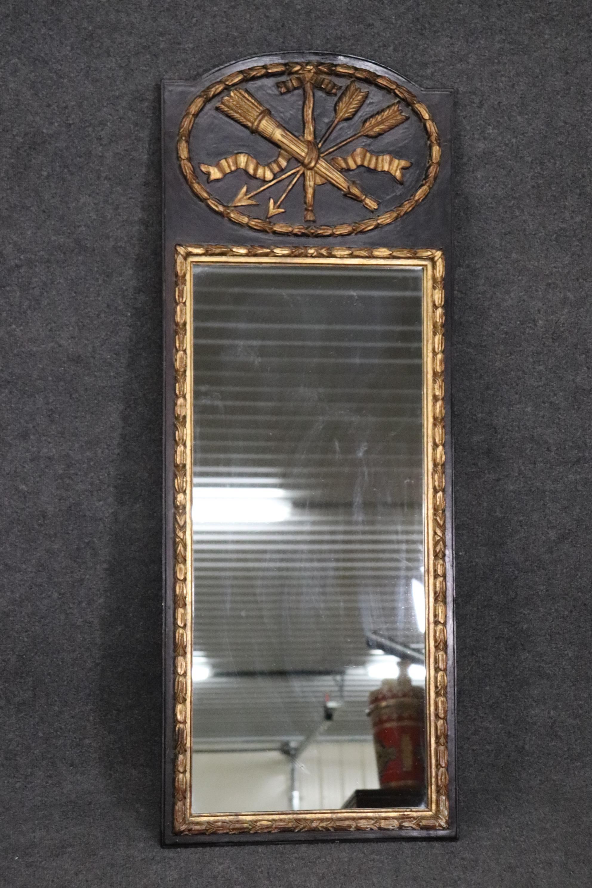 This is a beautiful Italian-made French Louis XV mirror. The frame is done in an black finish and gilded as well. The mirror measures 51 tall x 19 wide x 1.5 diameter. This mirror is in very good condition.