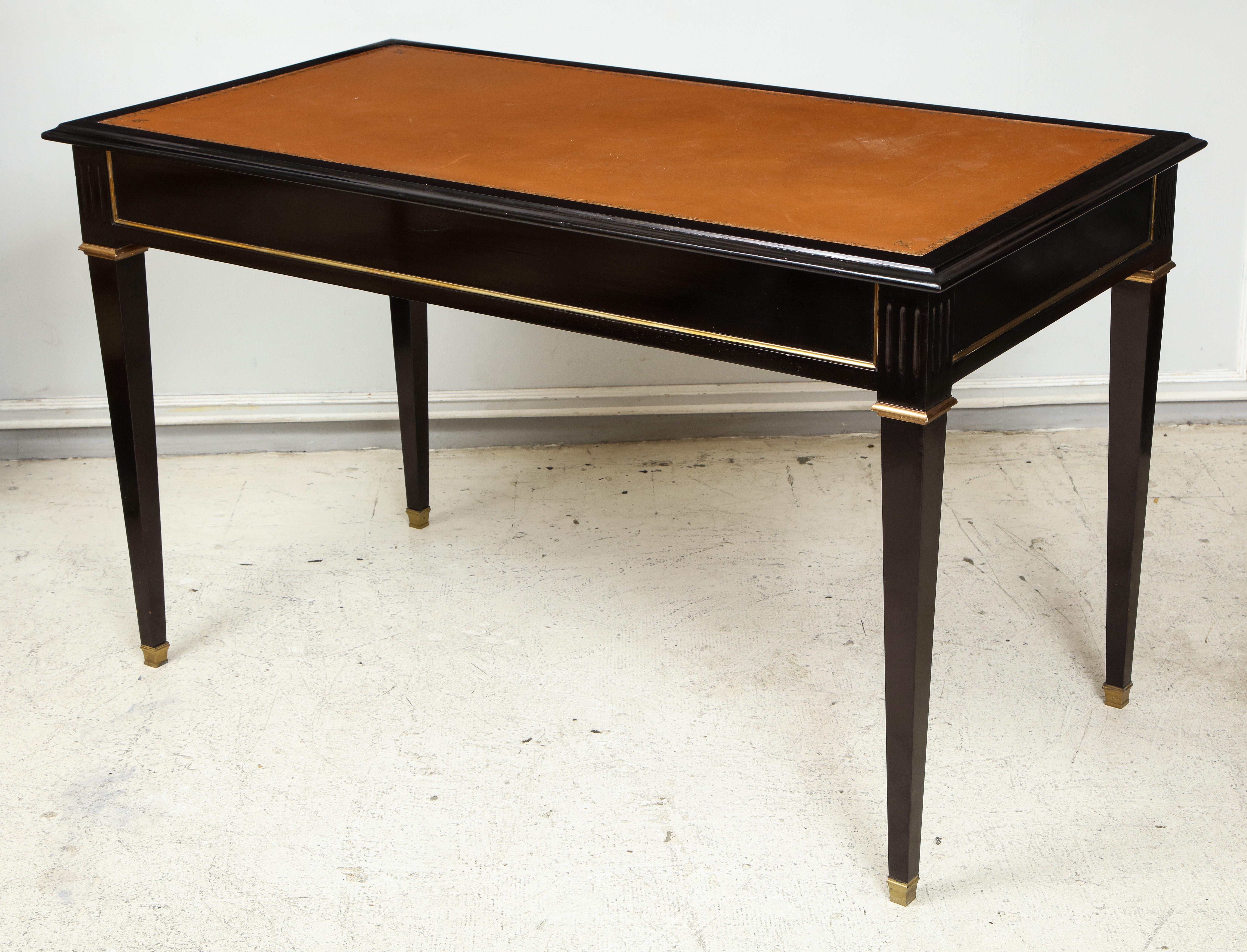 Ebonized leather-top bronze-mounted bureauplat desk on tapered legs ending in bronze sabots. This desk is finished on both sides.