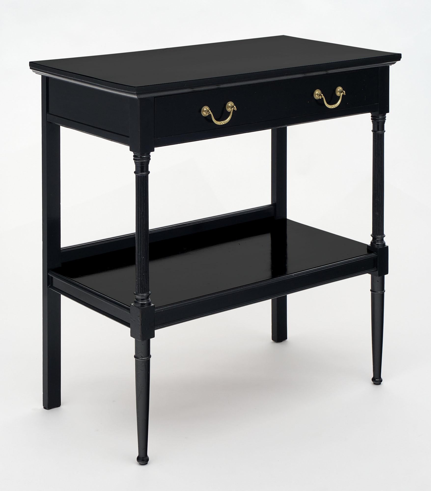 Console from France in the Louis XVI style made of mahogany with oak as a secondary wood. This piece is ebonized with a French polish finish. One functional dovetailed drawer features finely cast bronze hardware.