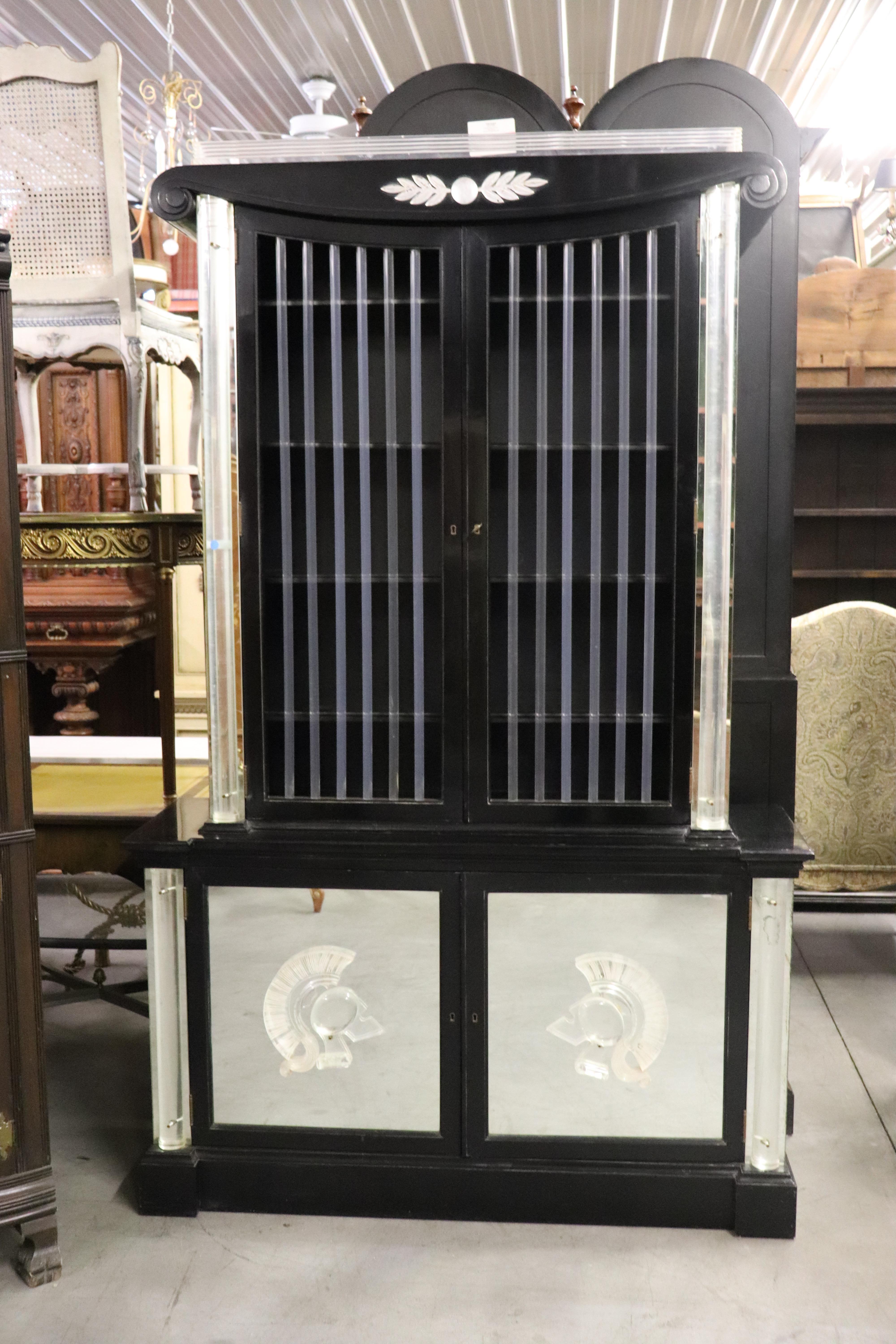 This is an original black lacquer and Lucite vitrine designed by Lorin Jackson for Grosfeld House circa 1940. The cabinet has it's original florescent lighting system and is in very good condition for its age and has no issues beyond minor wear from