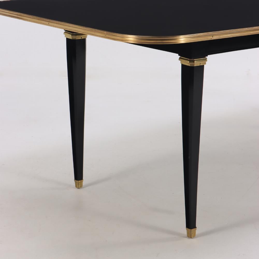 American Ebonized mahogany and bronze mounted dining table, C 1940, attributed to Jansen For Sale