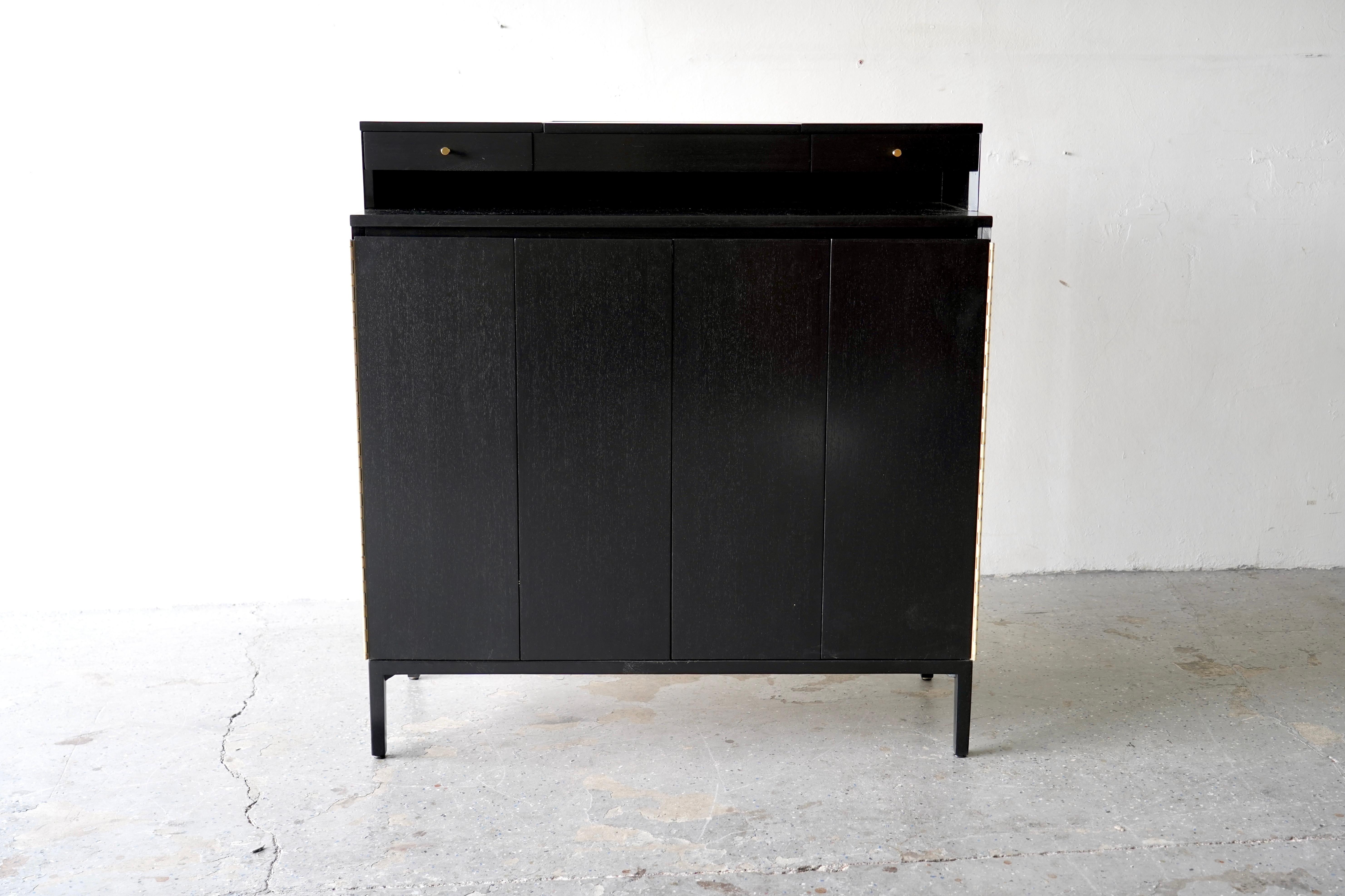 Mid-20th Century Ebonized Mahogany Concealed Gentleman’s Chest by Paul McCobb for Calvin