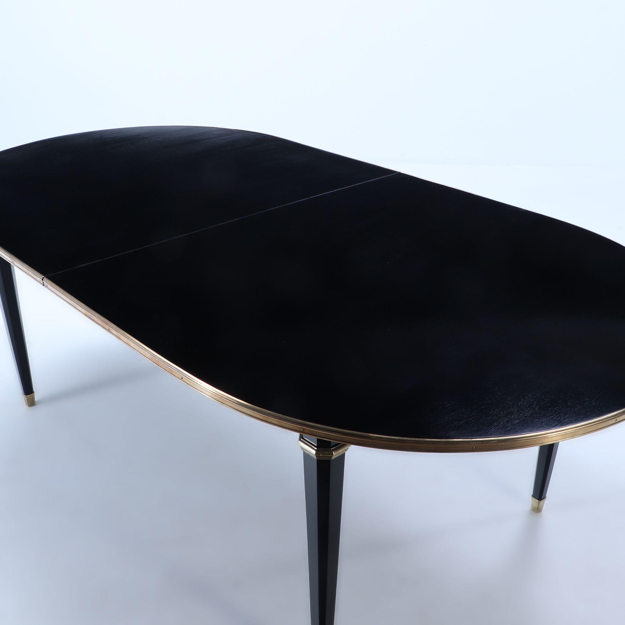 Mid-Century Modern Ebonized mahogany dining table attributed to Jansen having one leaf C 1940 For Sale