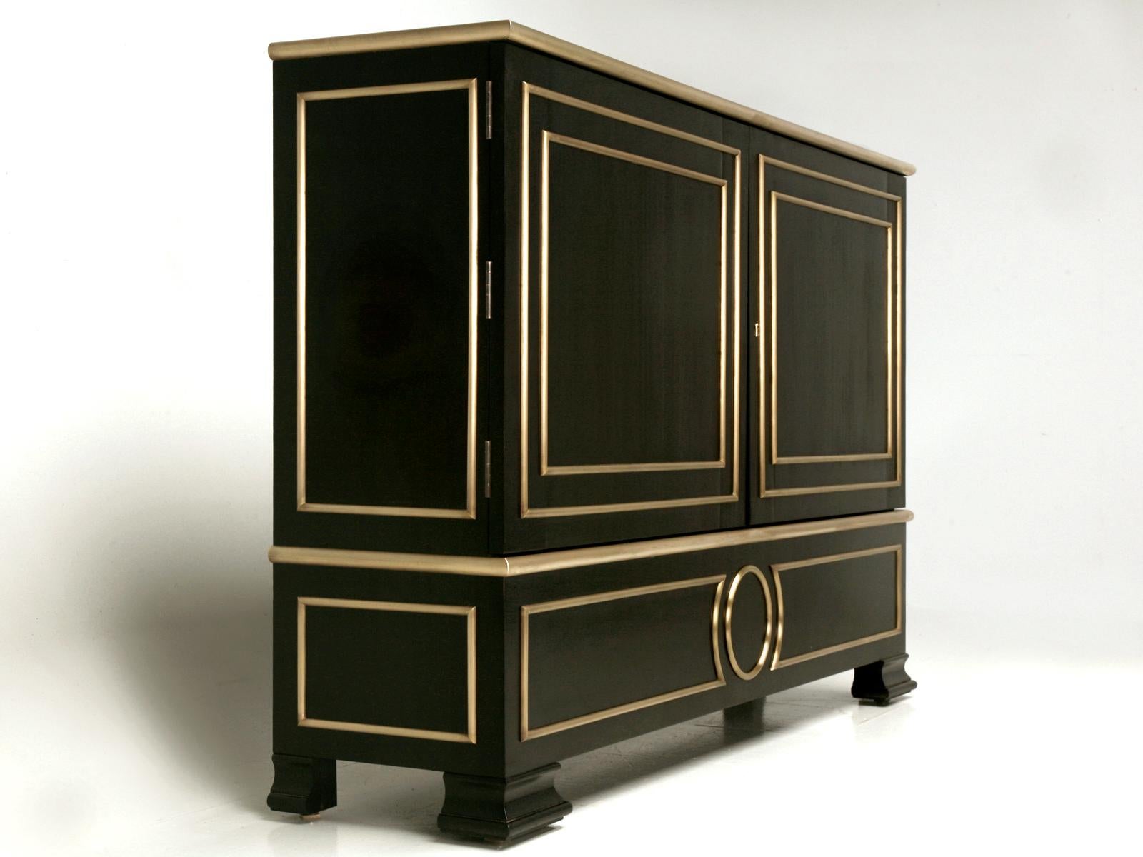 Our ebonized mahogany Directoire style buffet with solid bronze trim was custom made in the Old Plank Workshop. The buffet is handcrafted and built from solid mahogany, then triple-sanded smooth and coated with an old-fashioned hand-rubbed ebonized