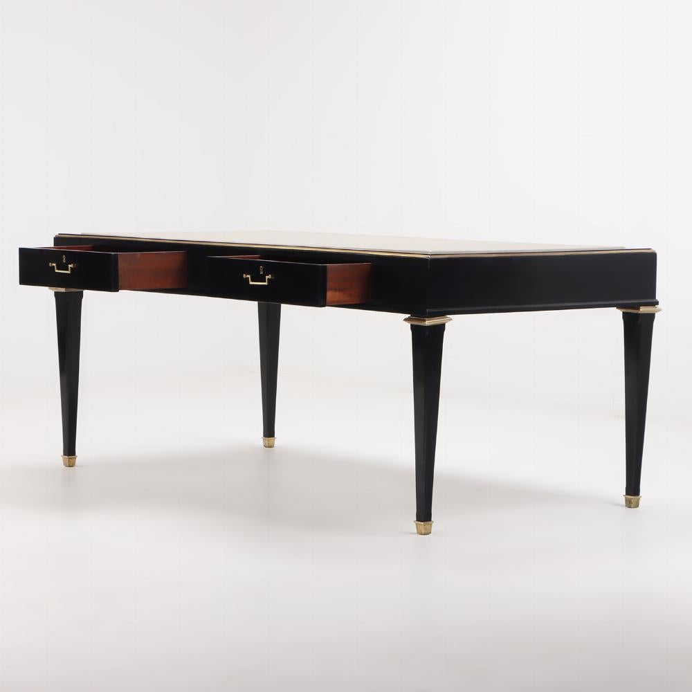 Mid-Century Modern Ebonized mahogany leather top desk in the manner of Andre Arbus C 1950.  For Sale