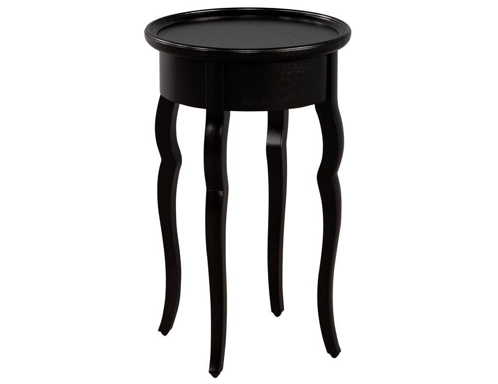 Ebonized mahogany occasional drink table. Jellyfish design with curved sculpted legs. Finished in a satin ebonized black.

Price is for pair and includes complimentary curb side delivery to the continental USA.