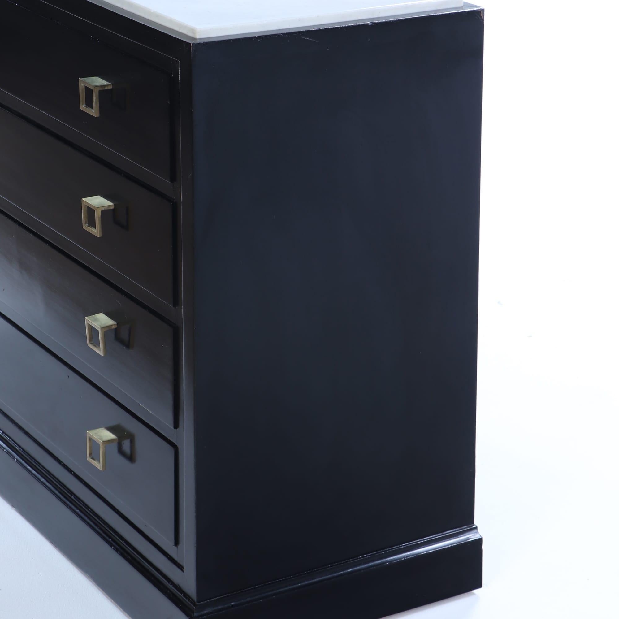 Ebonized marble top dresser having geometric brass drawer pulls C 1960. In Good Condition For Sale In Philadelphia, PA