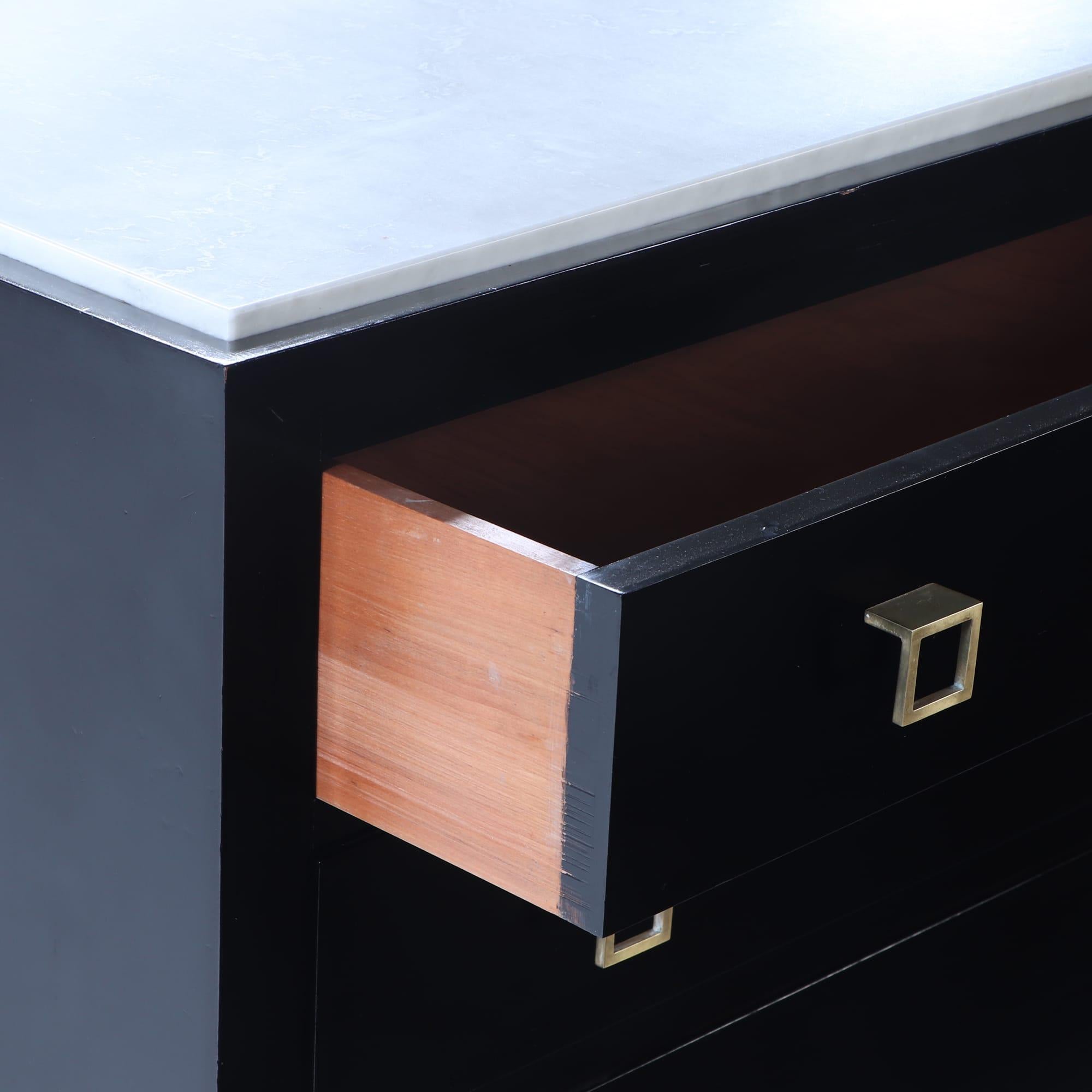 Brass Ebonized marble top dresser having geometric brass drawer pulls C 1960. For Sale