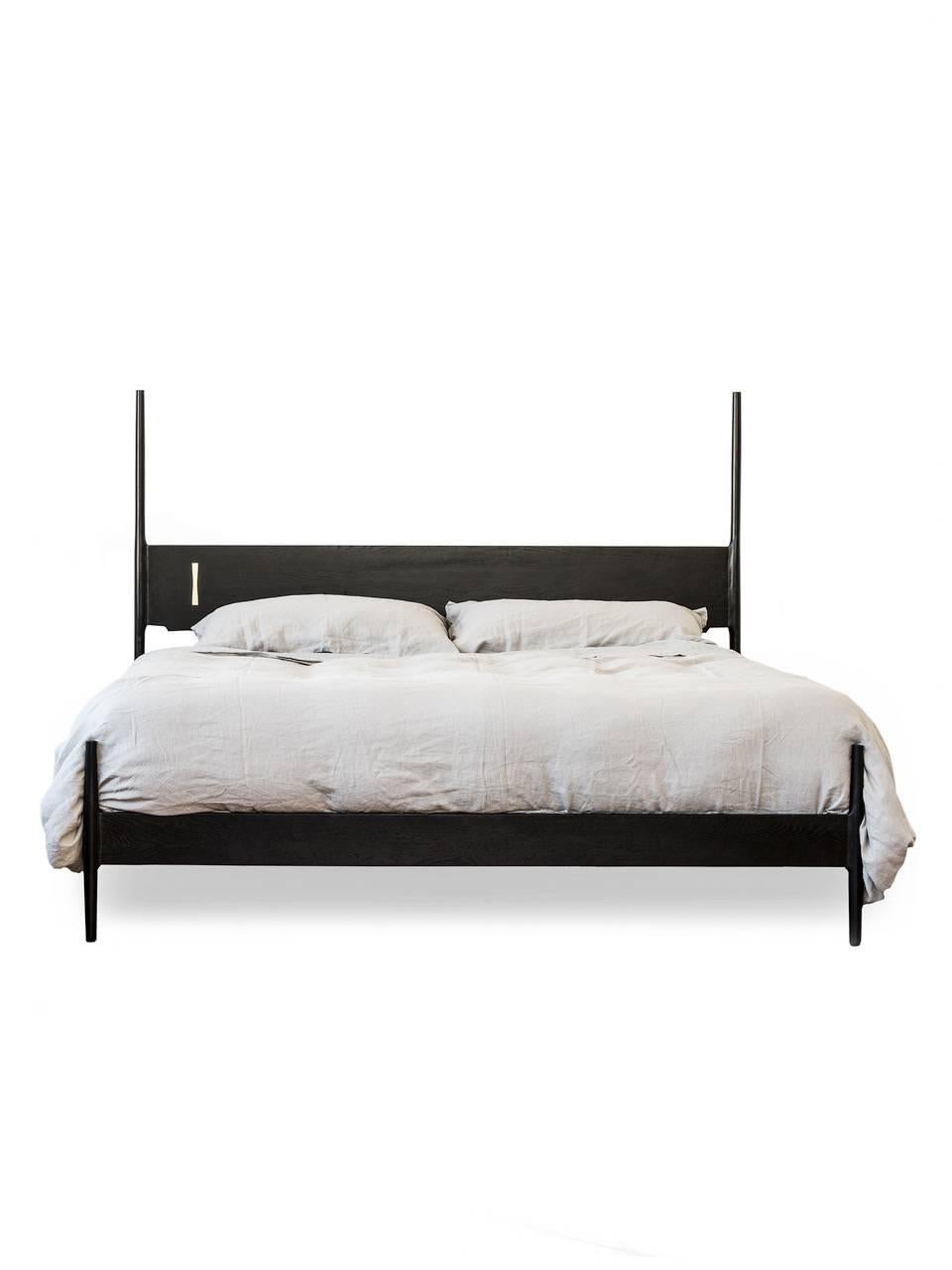 Posted bed with solid wood construction, hand-cut joinery and custom Dutchman brass joint. Handmade in Los Angeles, California.  

Bed frame available in an Eastern Standard King, Super King, Cal King or Queen. 

As shown in ebonized oak with brass