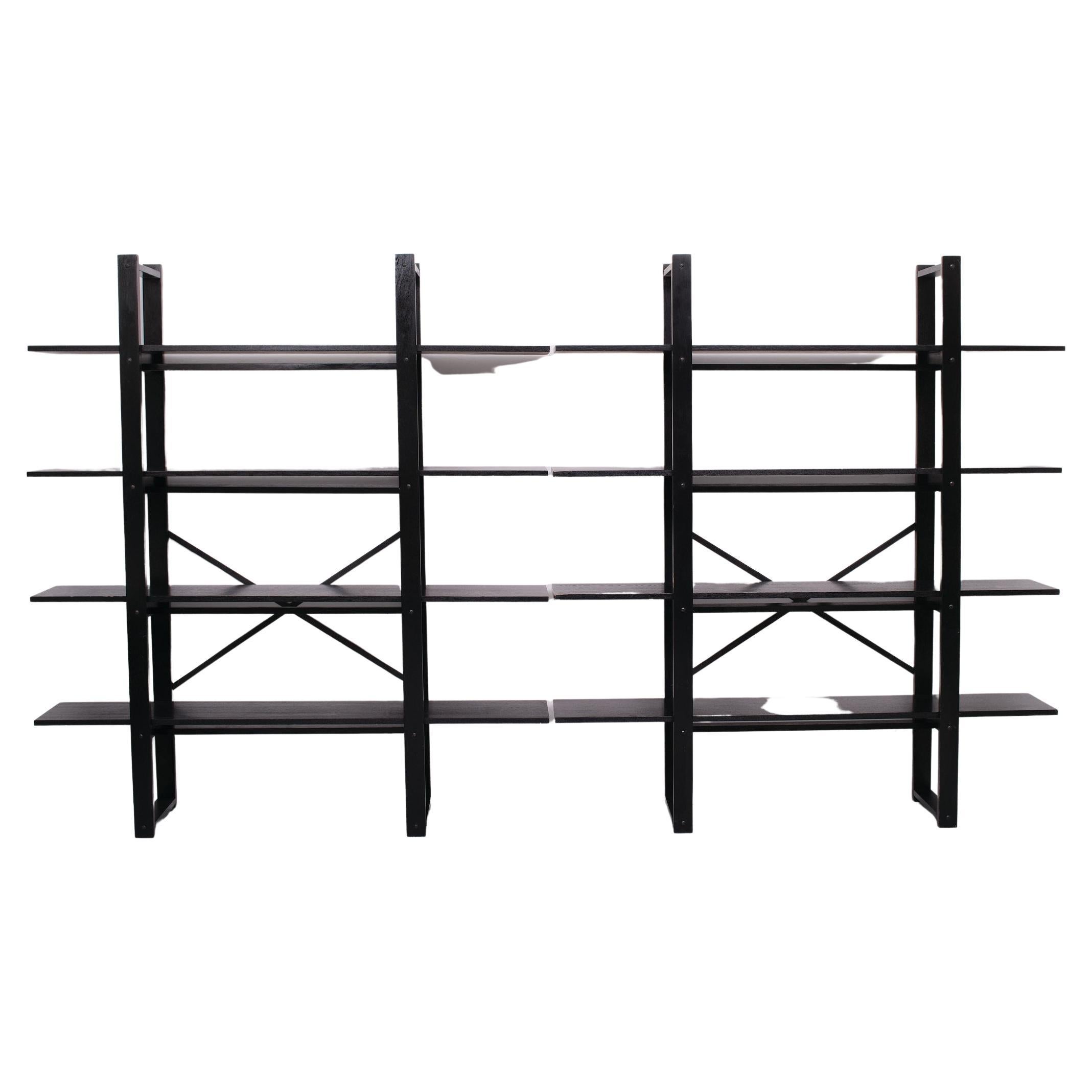 Very nice looking Shelving system beautiful Ebonized solid oak shelves. Ideal as a room divider or corner arrangement. Or bookcase. Great useful set.
1970s Attributed to Niels Gammelgaard early version. Rare set. 
 The measurements are for one