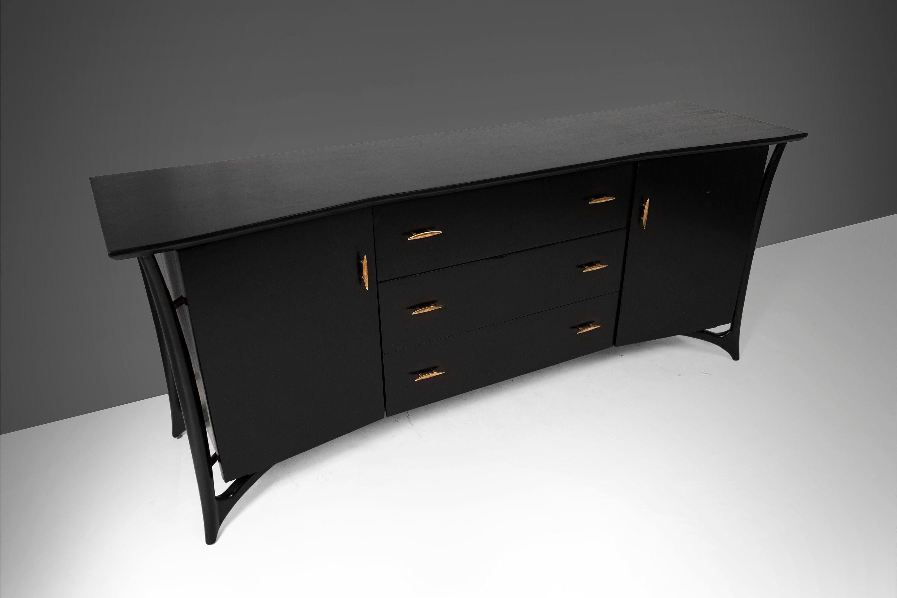 An exceptional architectural build. Designed by Piet Hein and retailed exclusively for Daniel Jones, NYC. This c. 1960 nine drawer dresser has been newly ebonized. The base is set on a sculpted architectural base. Behind the left and right facing