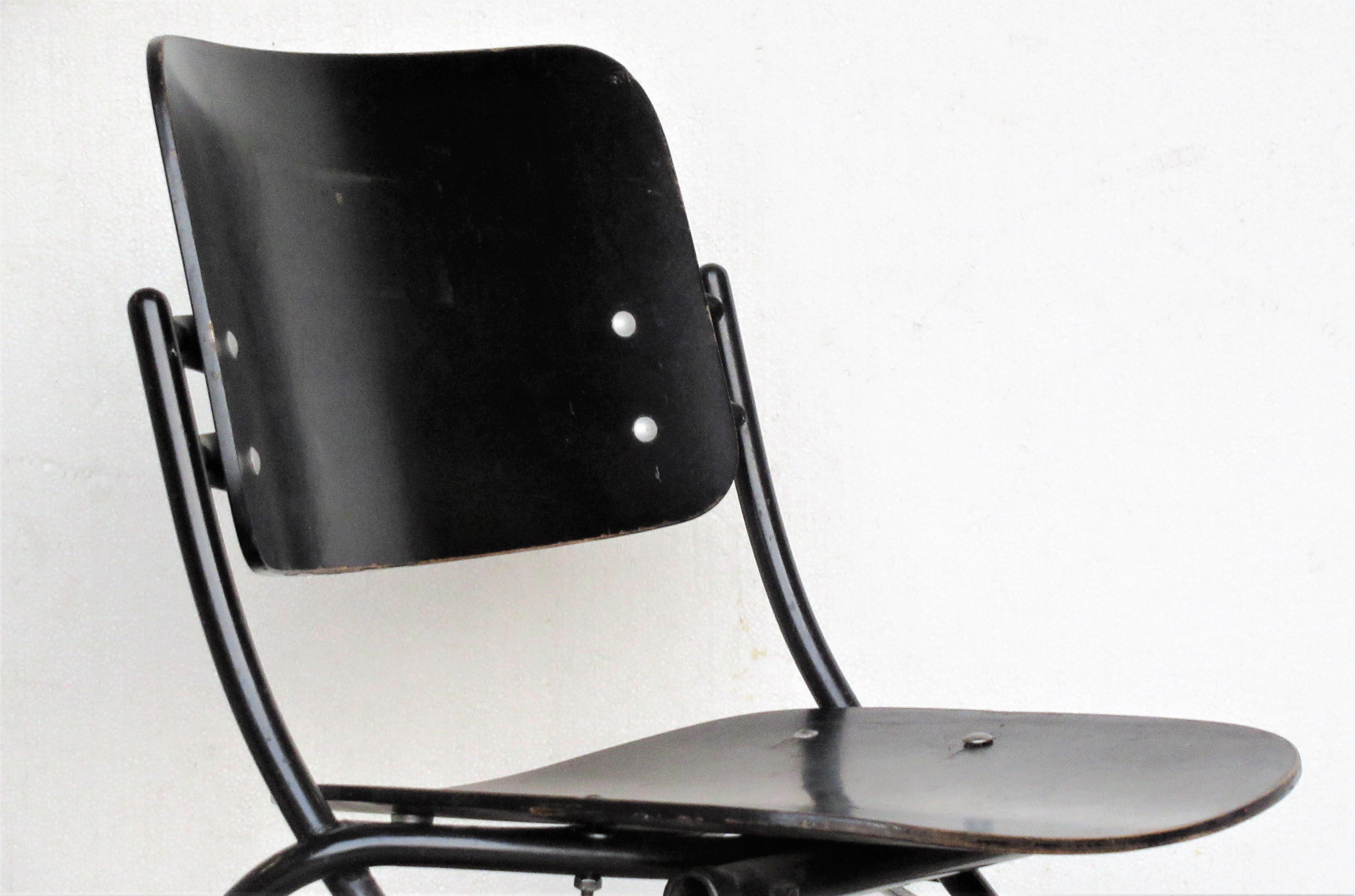Ebonized plywood side chair with black enameled tubular steel legs by Finnish designer - Ilmari Tapiovaara for Thonet. Two labels on underside / paper label -Thonet, One Park Avenue NY & blue paper label - Thonet Industries One Park Avenue NY,