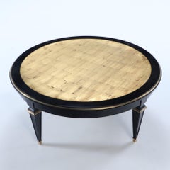 Ebonized round coffee table in the manner of Jansen circa 1940