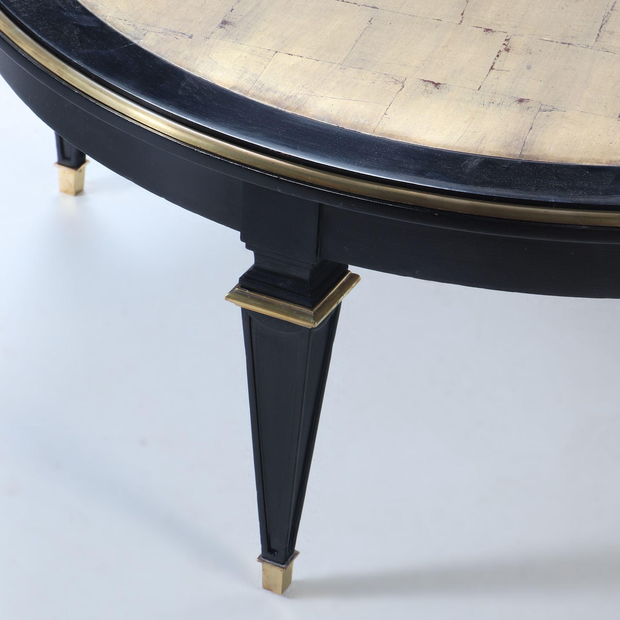 French Ebonized round coffee table in the manner of Jansen circa 1940 For Sale