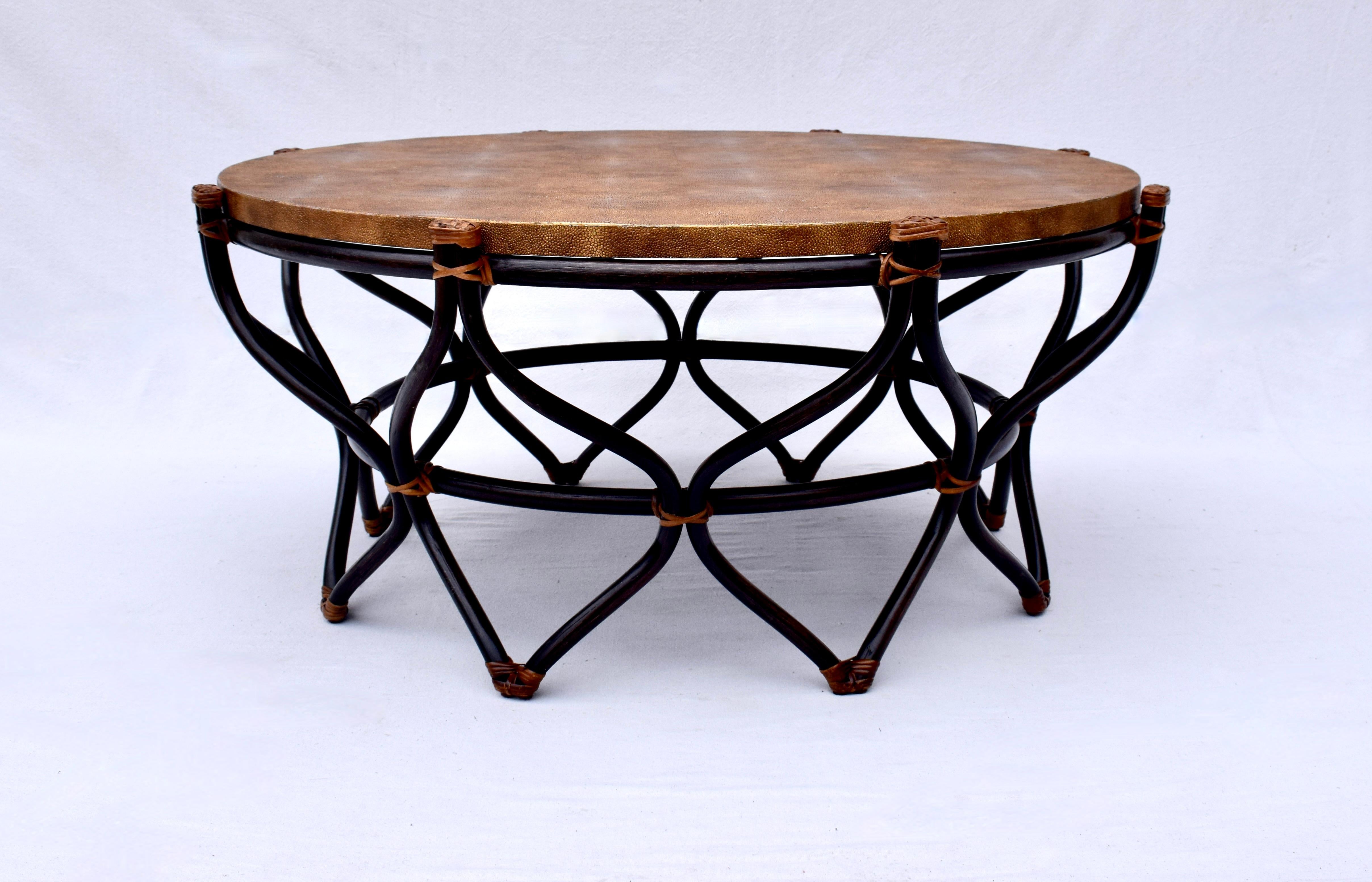 Sculptured ebonized bent bamboo rattan coffee table with striking faux shagreen round top in copper tones lending rich texture to clean, modern lines.