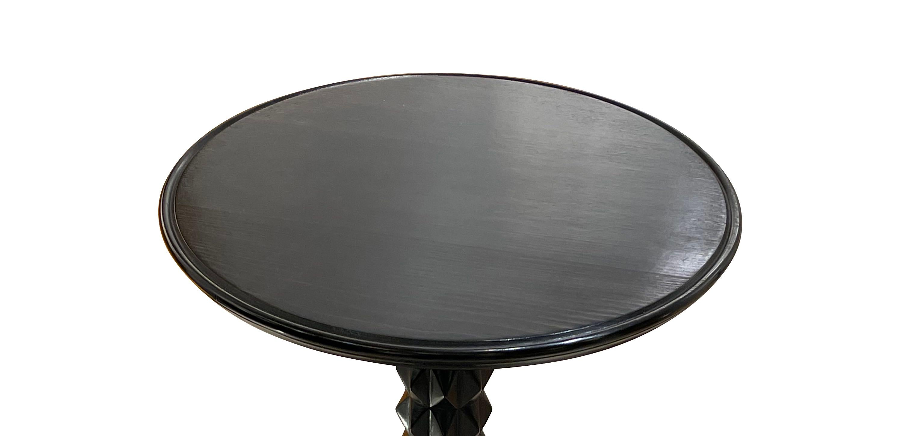 1940's French Charles Dudouyt ebonized side table.
The column is sculpted in a signature design of Charles Dudouyt.
The round top has a raised lip detail.
Three dimensional raised rings decorate the base.
This table can be used as a side or cocktail
