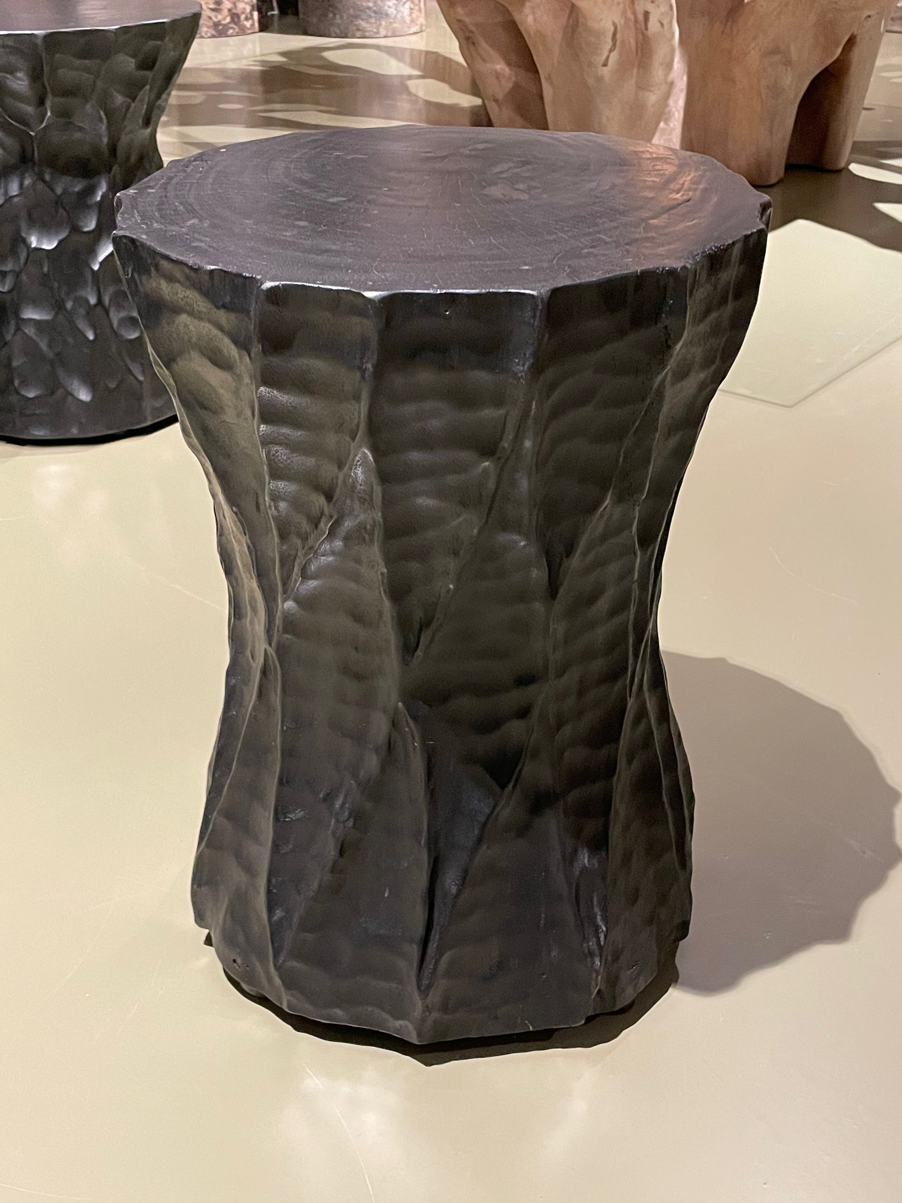 Contemporary Indonesian ebonized suar wood side table in an hour glass shape.
Decorative carved details on all sides.

