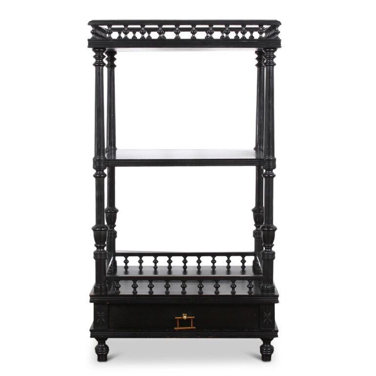 French etagere from late 19th century , in ebonized wood. Composed of 3 tiers with a lower drawer with a chinoiserie style brass handle.