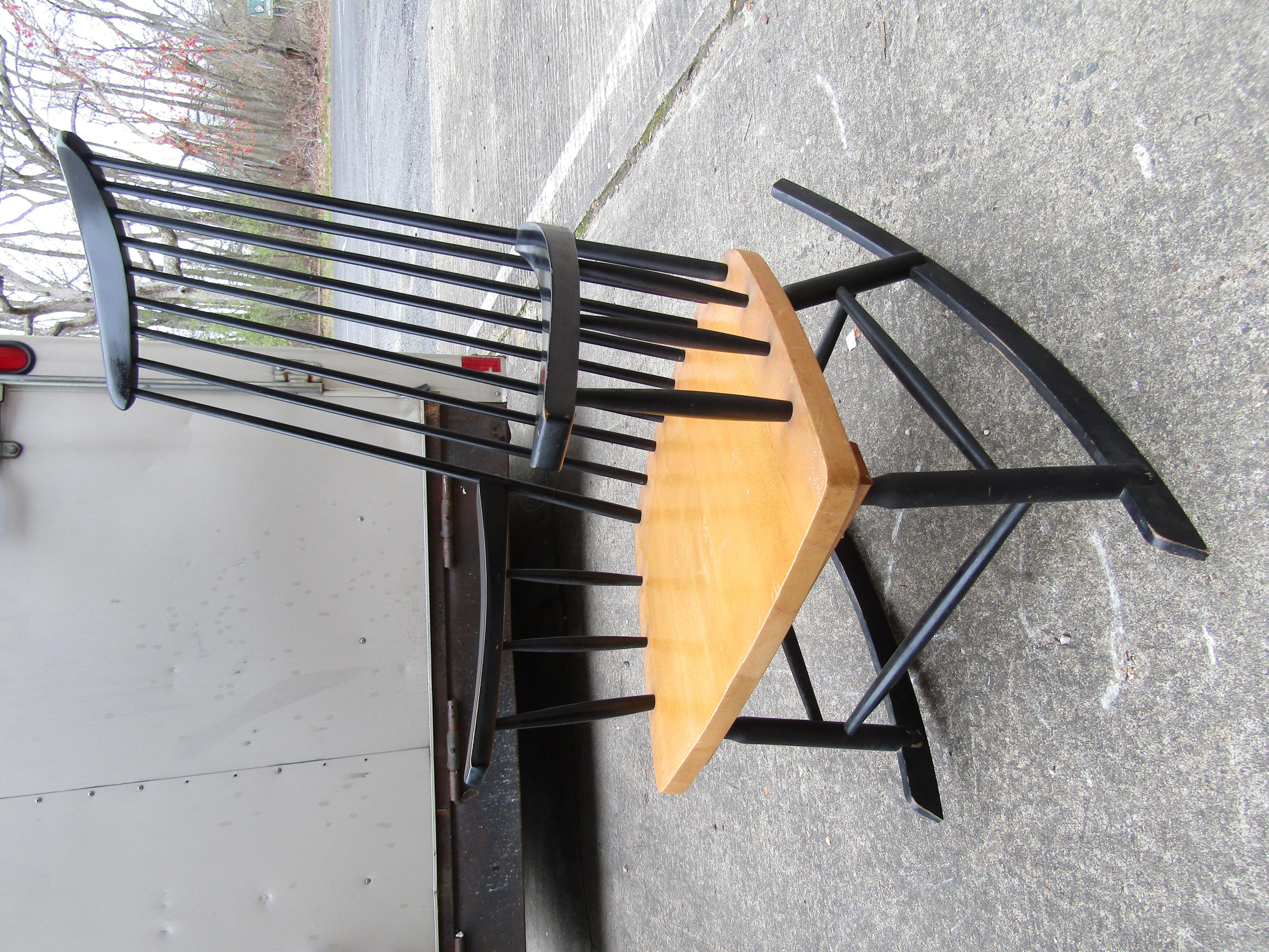 Mid-Century Modern stylish rocking chair featured in an ebonized frame, slatted back and maple finished seat.

(Please confirm item location - NY or NJ - with dealer).