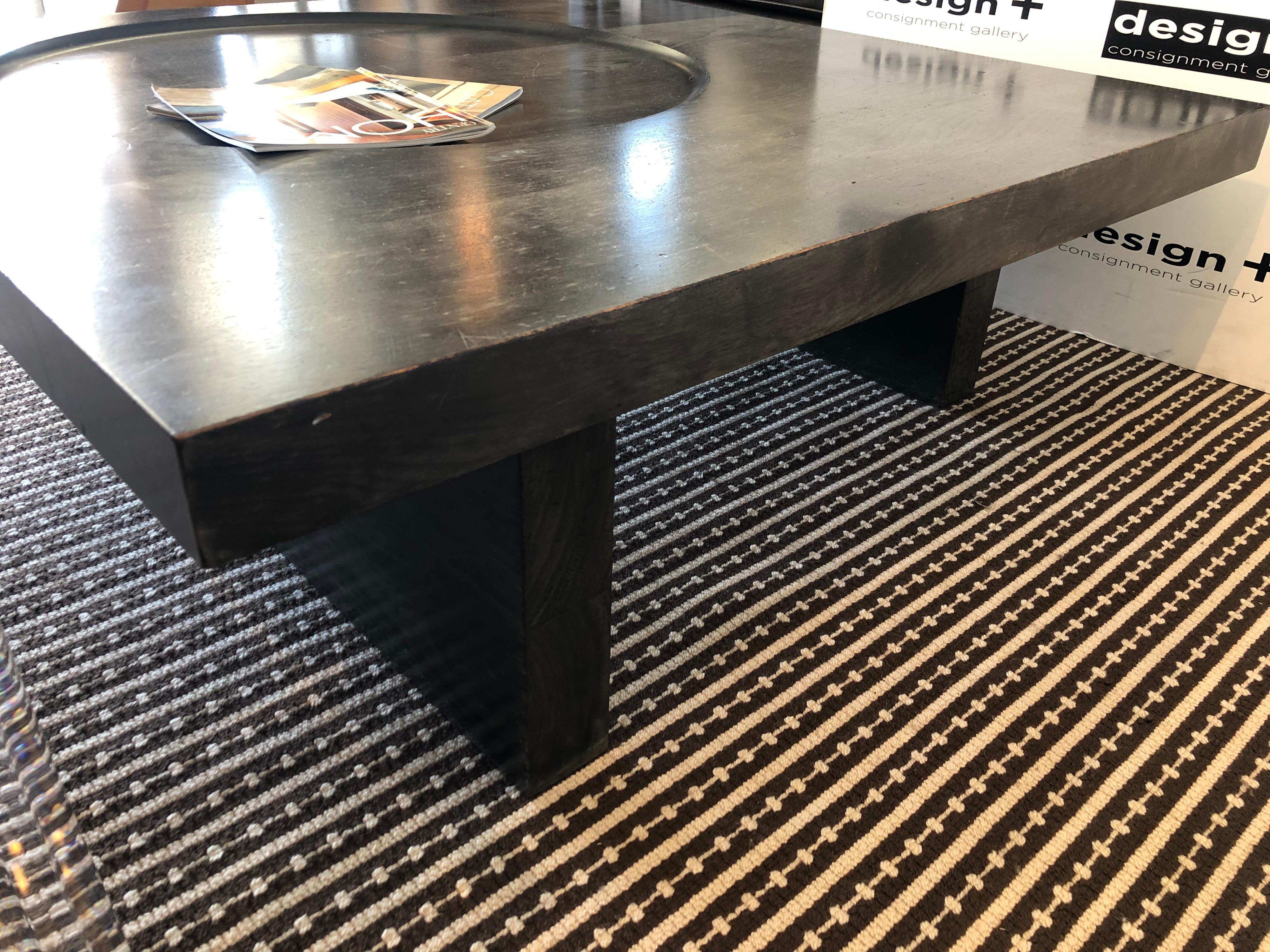 A monolithic coffee table by Gulassa & Co. solid American black walnut, the striking contemporary Silhouette is further modernized with a ebonized finish. Dish shaped indentation references the table name.

Original price: $8,000


