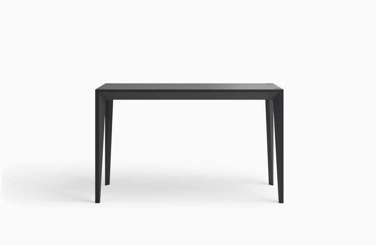 The faceted geometry of the MiMi console table creates a slender, elegant profile punctuated with angled surfaces that capture light. This sculptural and graceful design looks great from all angles. Thanks to its shallow depth–17 inches–it's a