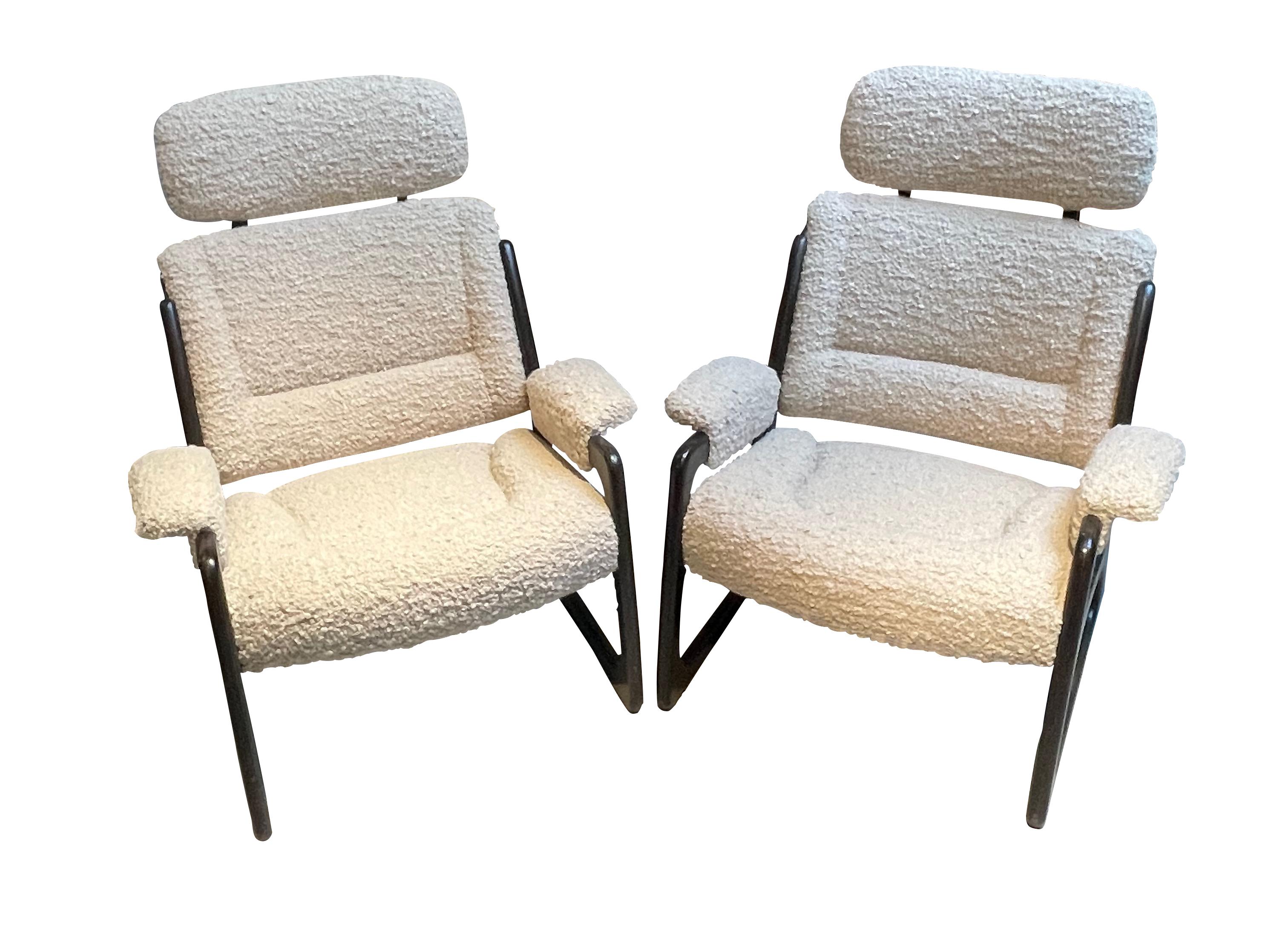 1960's Italian pair very comfortable side chairs with ebonized wood frame.
Removable headrest.
Newly reupholstered in white boucle.
Decorative recessed stitch details on back and seat.
Padded arm rests.
