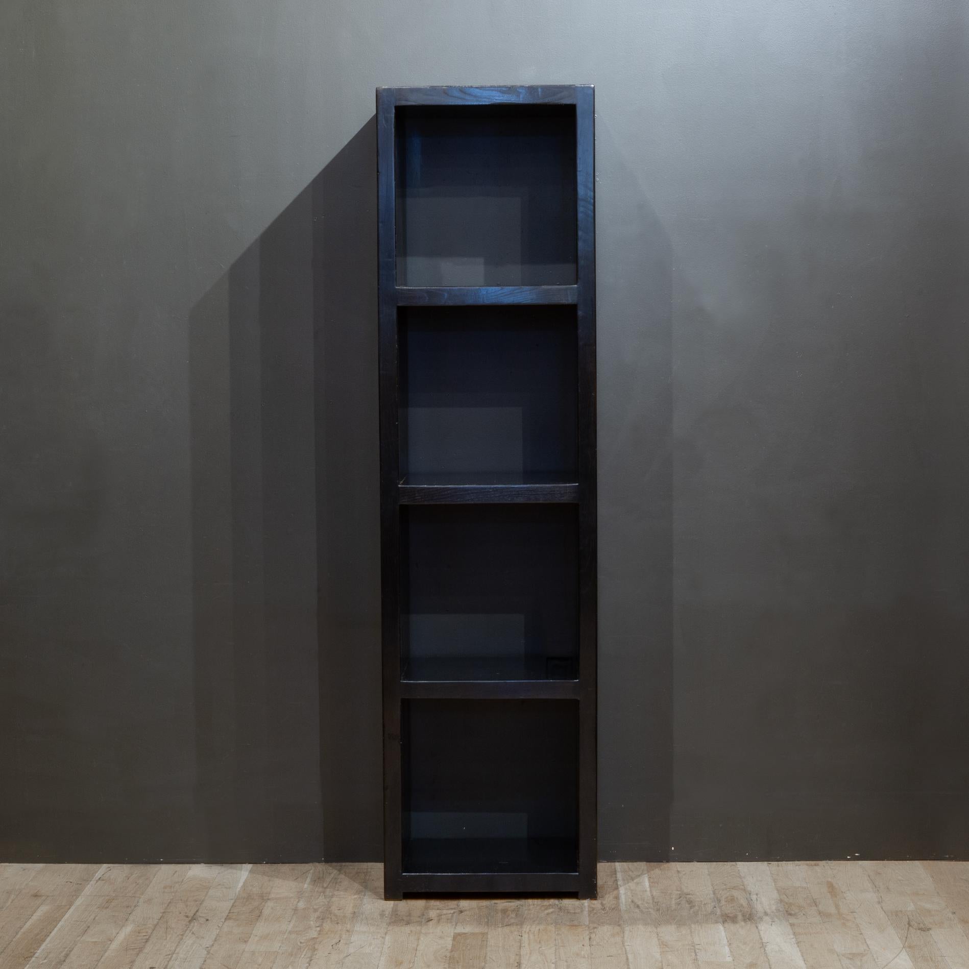 Solidly constructed ebonized wooden bookcase with four shelves. Open in the back and front. 
Inner shelves: 17.5