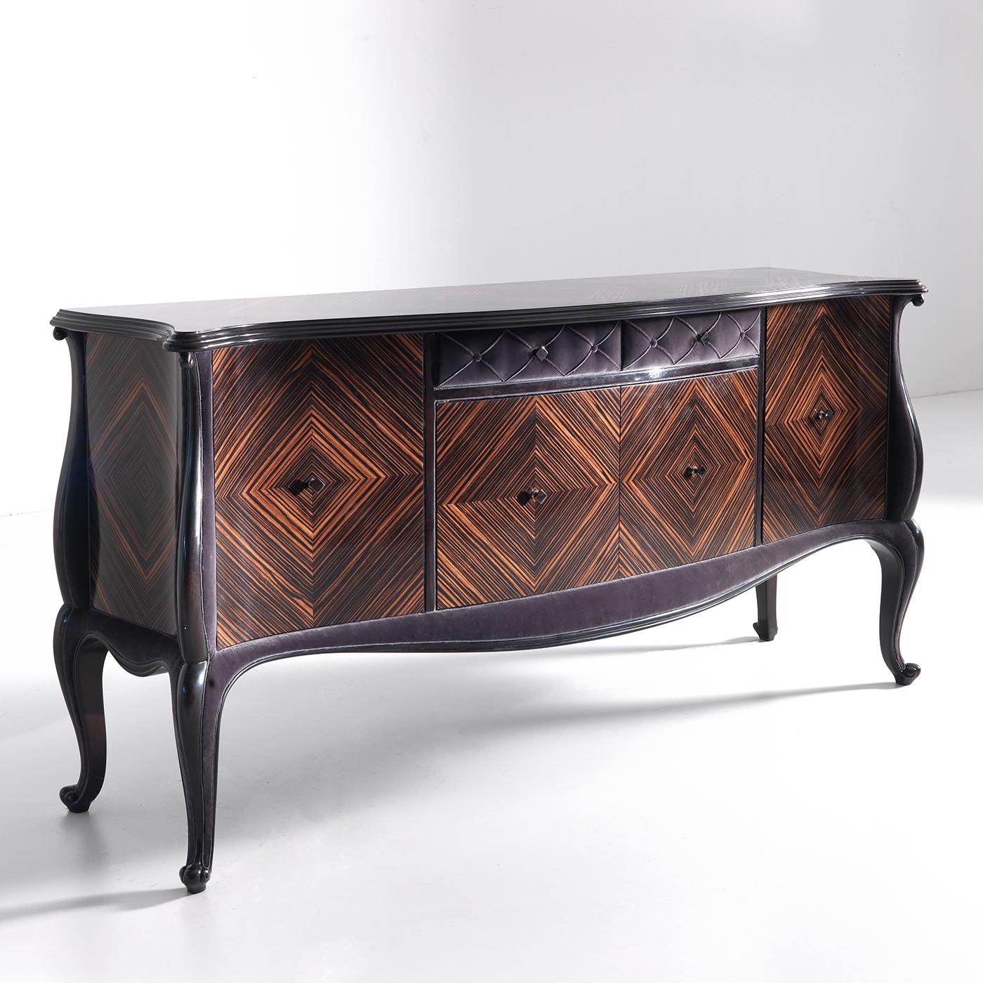 A celebration of Makassar ebony's undeniable elegance, this classic-inspired sideboard will provide invaluable storage space for different needs. Crafted of Makassar ebony enriched with fascinating velvet inserts, the piece stands out for the